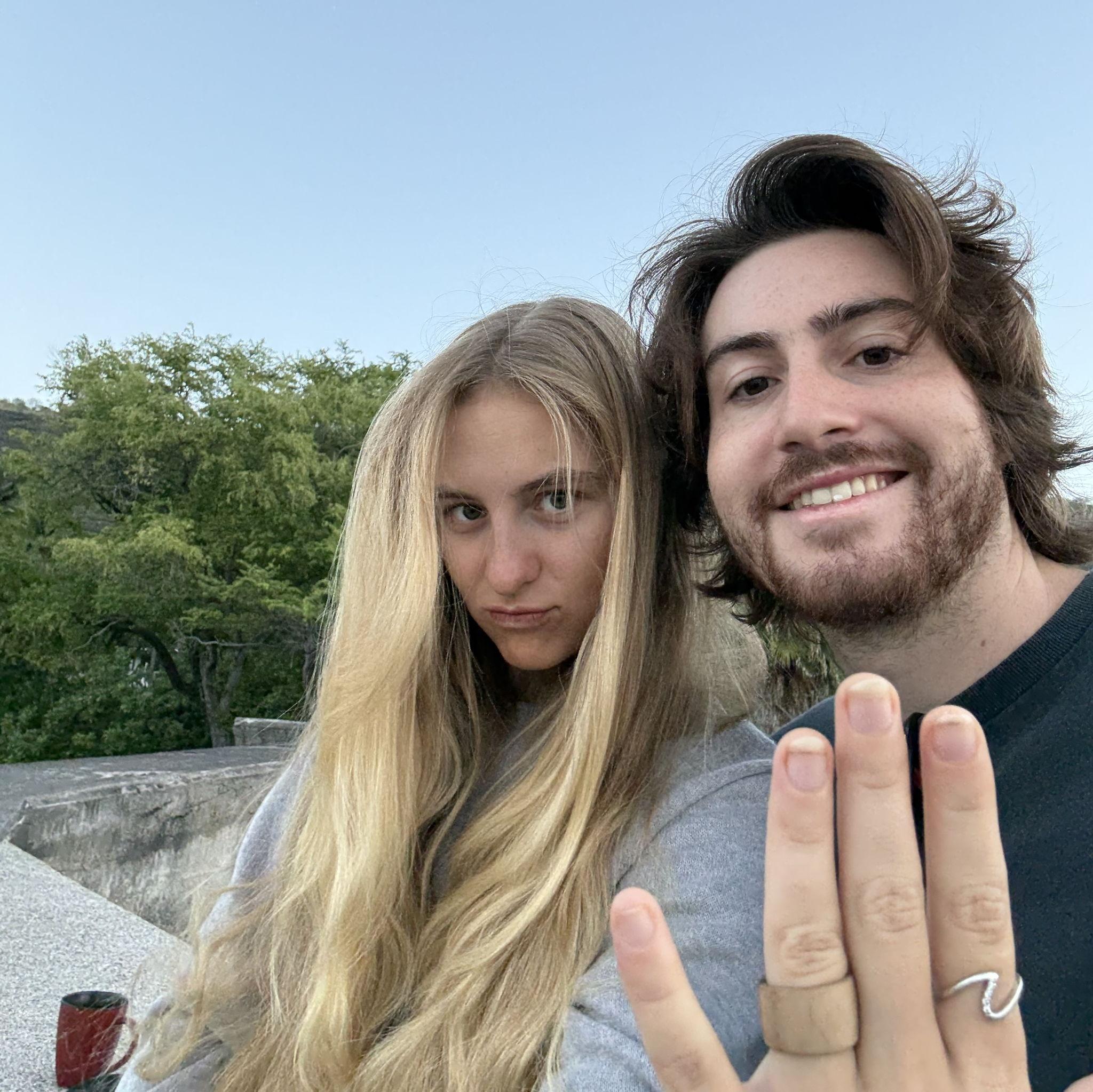 Moments after joel proposed with the wooden ring that he carved <3