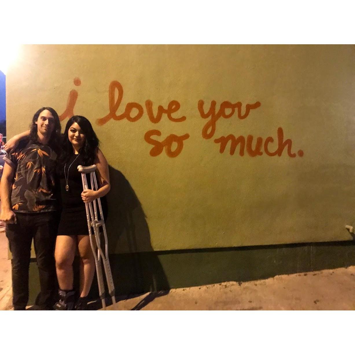 back at the wall in Austin, this time with a broken foot