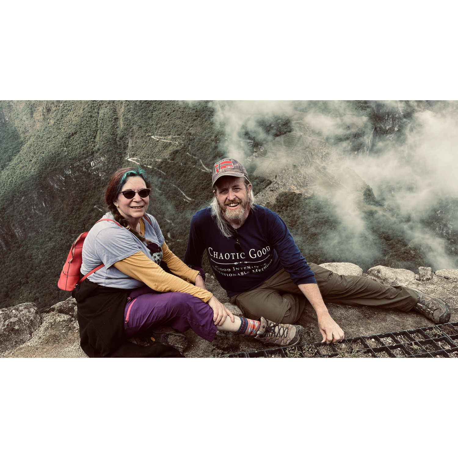 At the top of Waynapicchu behind Machu Picchu. We were tired but made it!