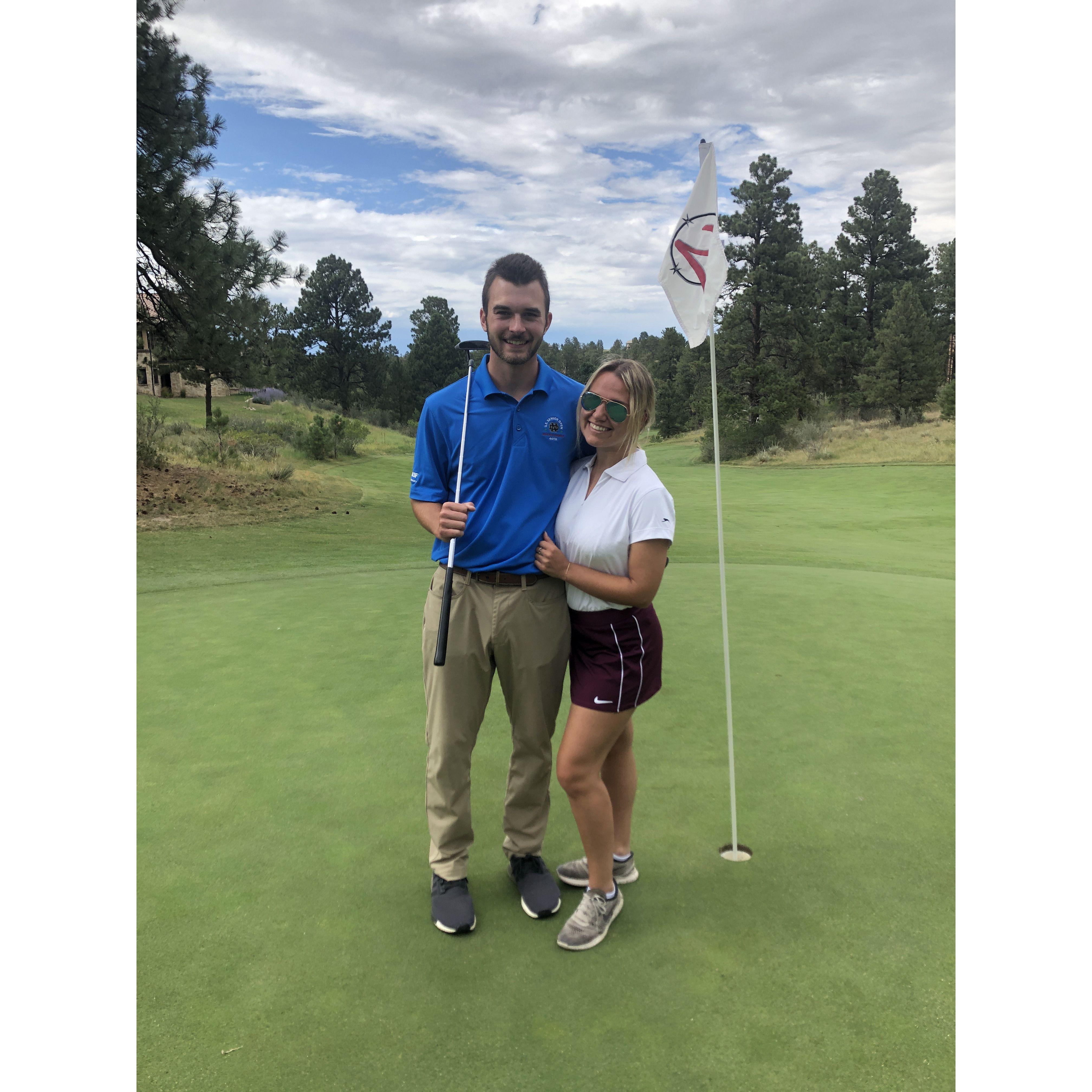 This photo is at Colorado Golf Club, where Thomas interned after his junior year of college. Jess, having no golf experience since about six years old, hung out with Juli while Thomas and Phil played.