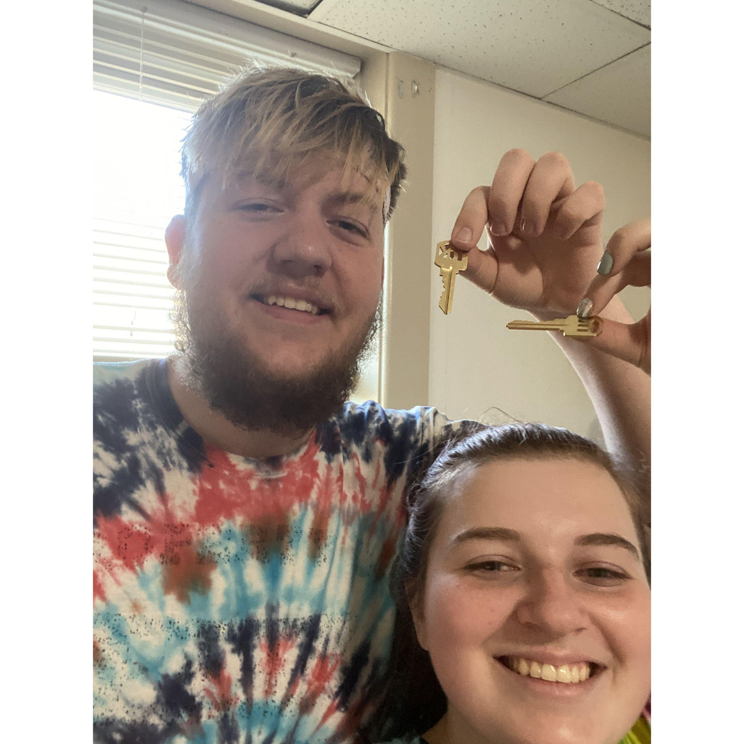 Us with the keys to our first apartment together.