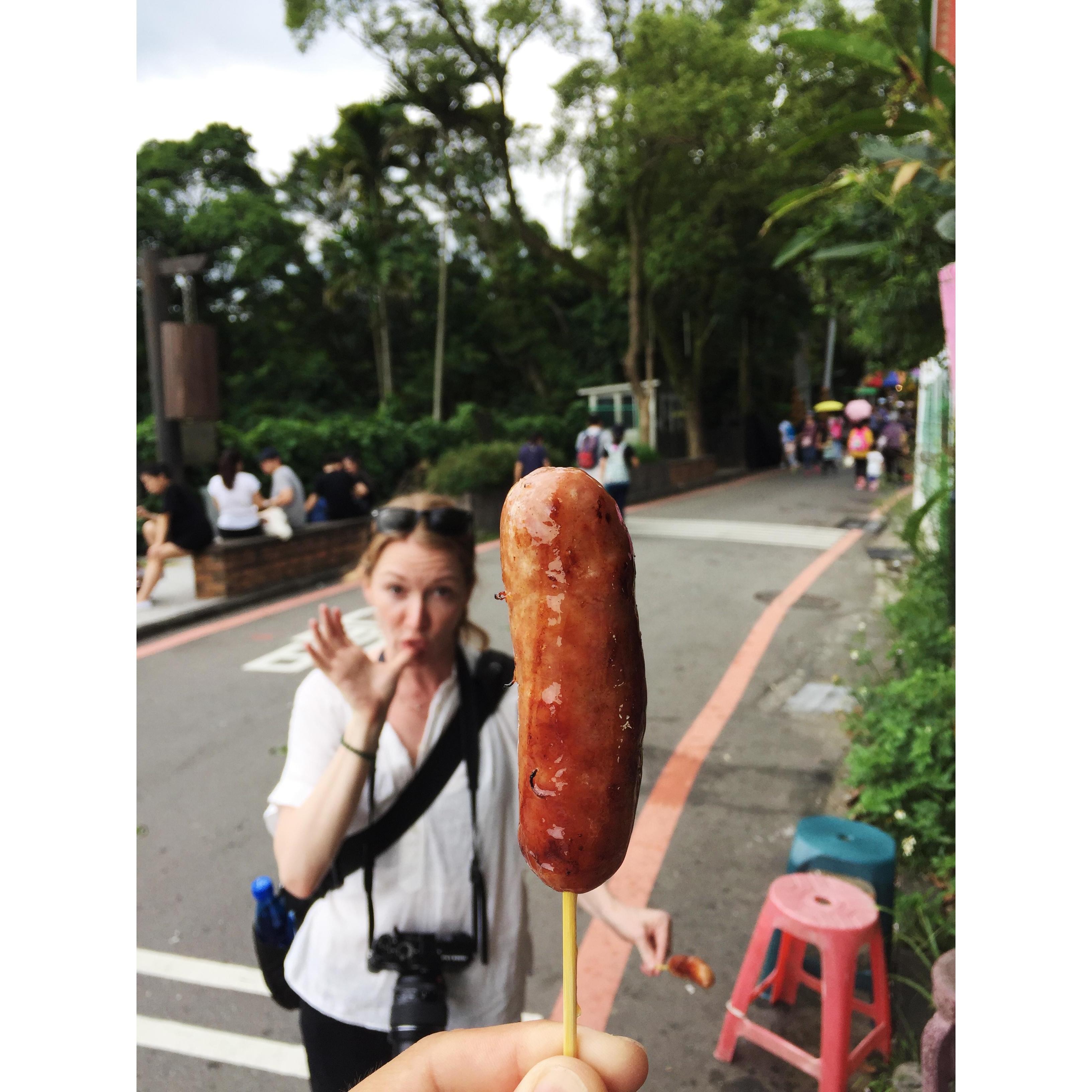 Michele enjoys the meat on a stick. Maokong, Taiwan.