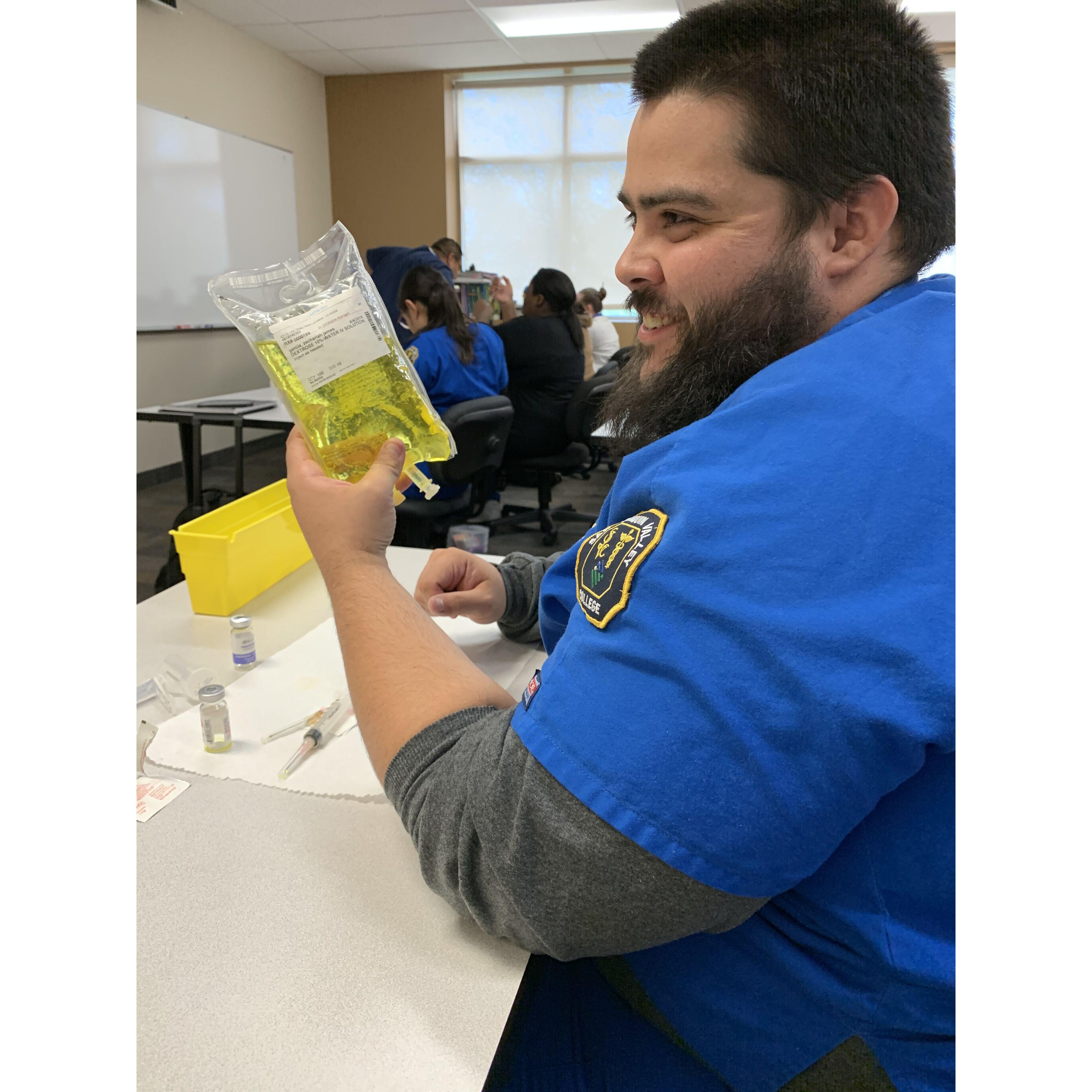 Aaron enjoying and rocking the pharmacy tech school!