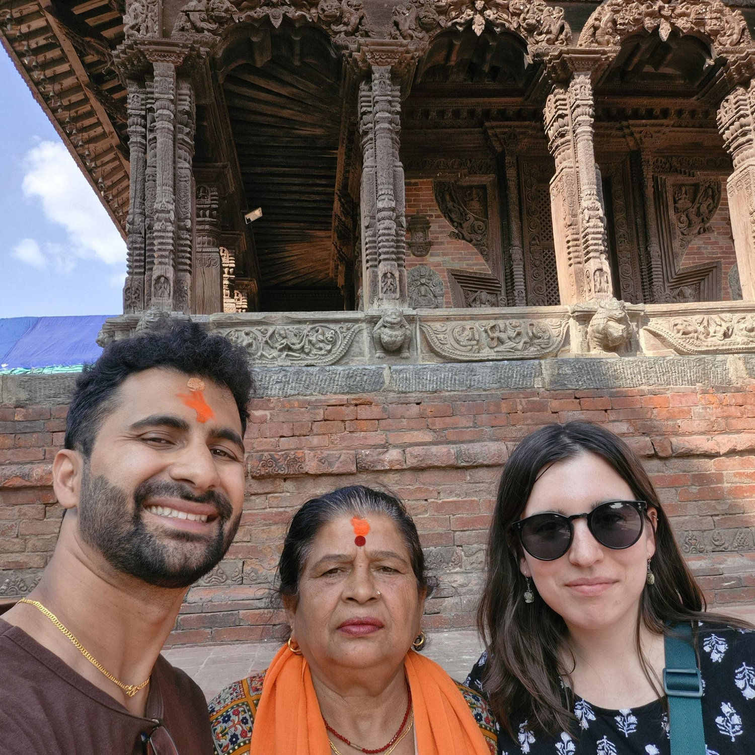 Dinesh, Erin, and Dinesh's biological mom Laxmi at a Durbar Square in Kathmandu