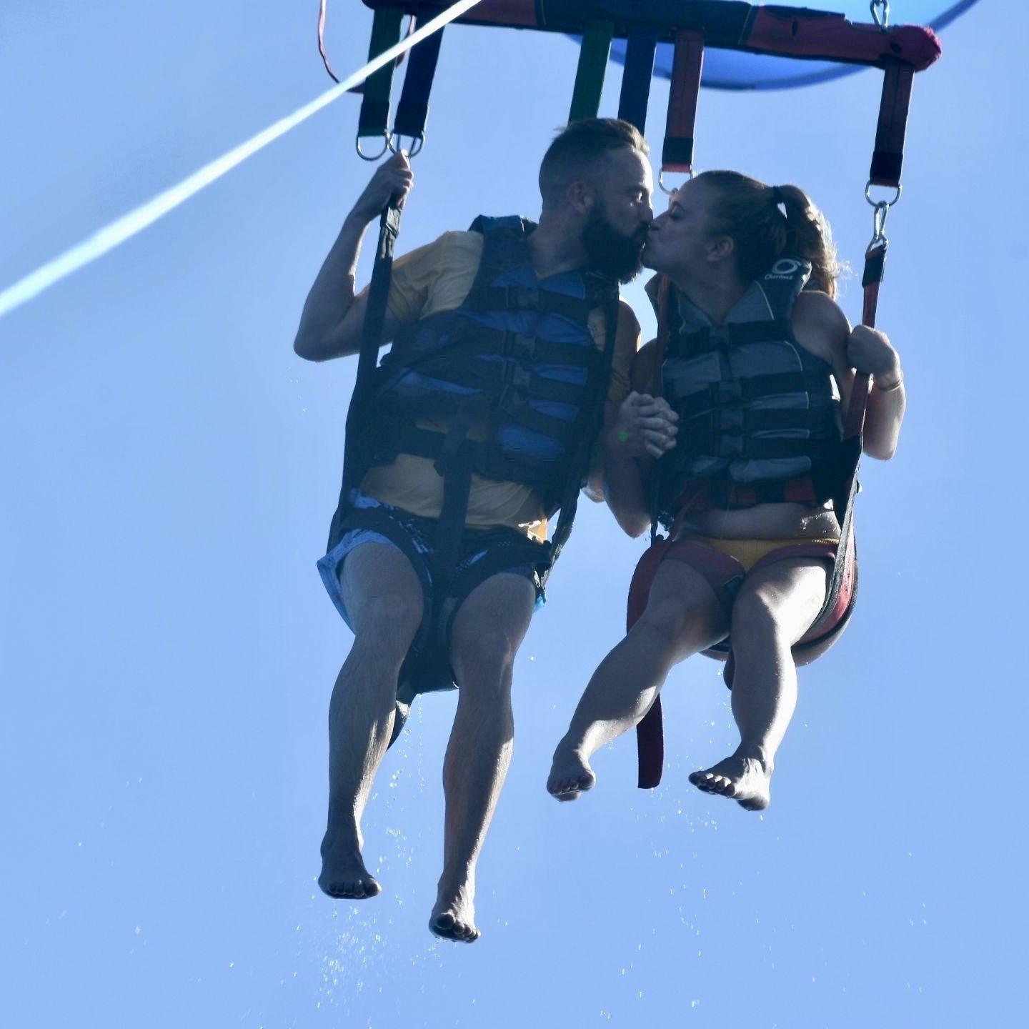 September 2024 - Parasailing in Honolulu. This was after Jamie blocked Corinne's face with his hand in all of the other pictures.