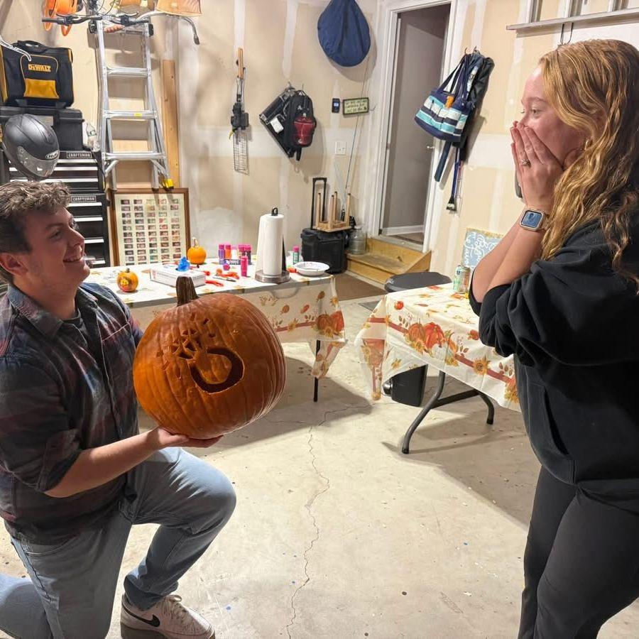 Reenacting Luke's proposal during our annual pumpkin carving tradition!