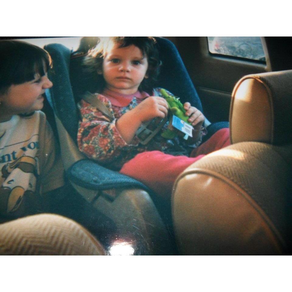 My sister and I in the 90's. I'm on the left and she is on the right. She is holding a Teletubby key chain.