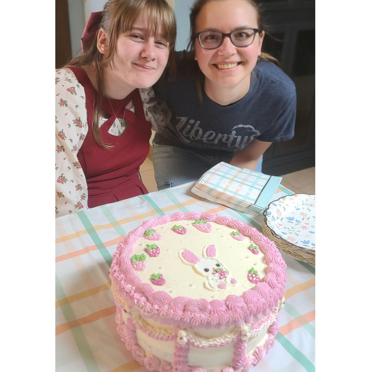Brides Daughter Mara celebrates with cake made by bridesmaid Amy.