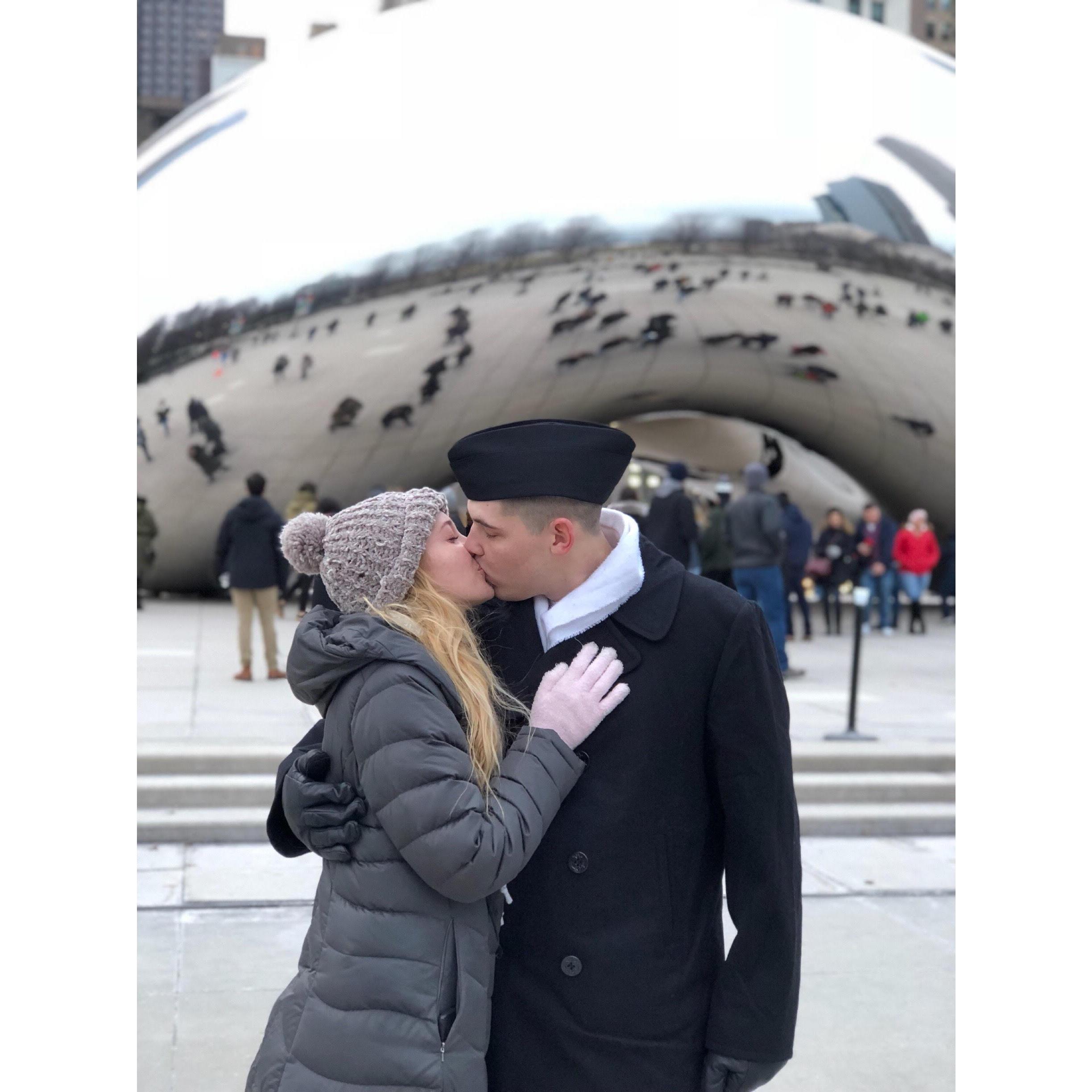 Kissing in front of the Chicago Cloud Gate sculpture AKA ‘the Bean,’