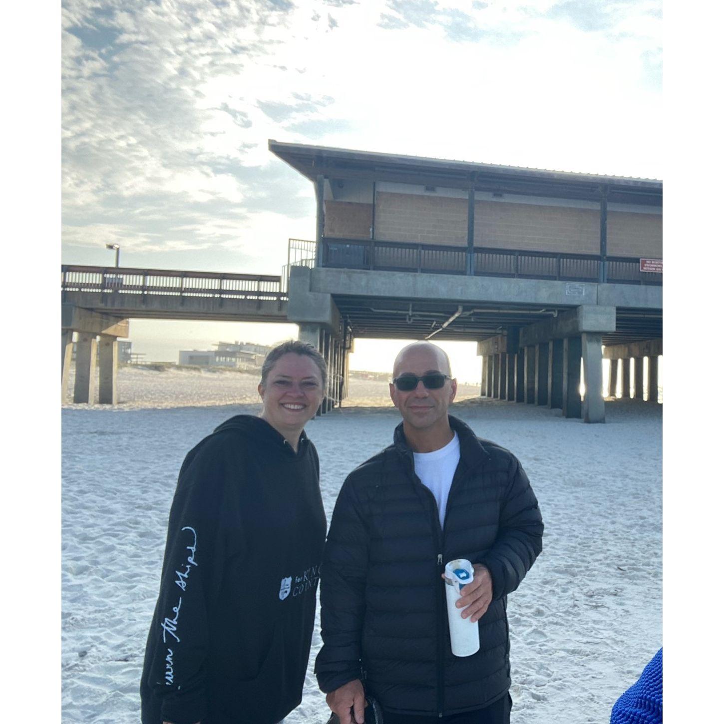 This picture was taken of us after we watched the sunrise on the beach in Gulf Shores, Alabama. We walked a few hours along the beach to the pier and back.