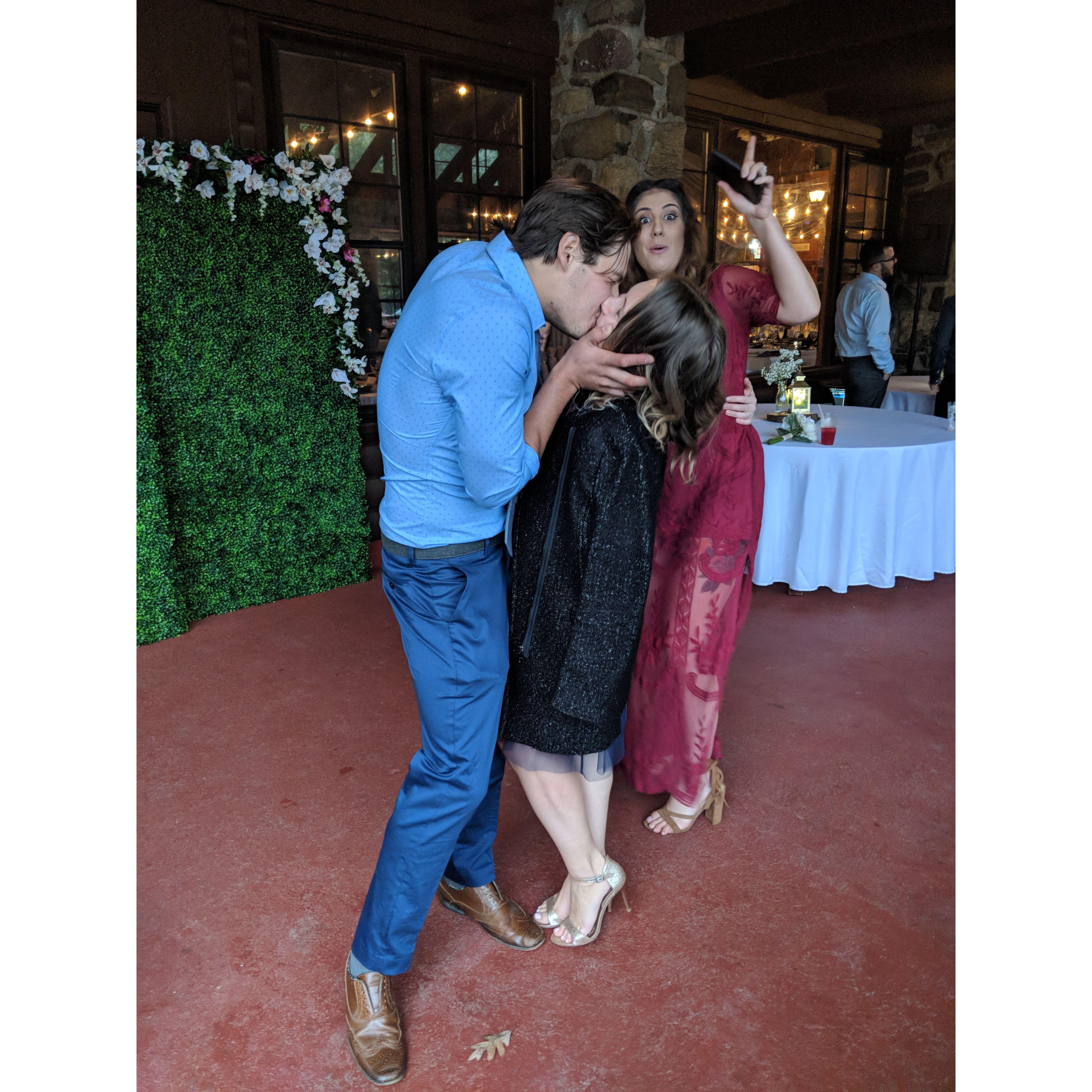 Sneaking in a kiss at Steph & Matthew's wedding