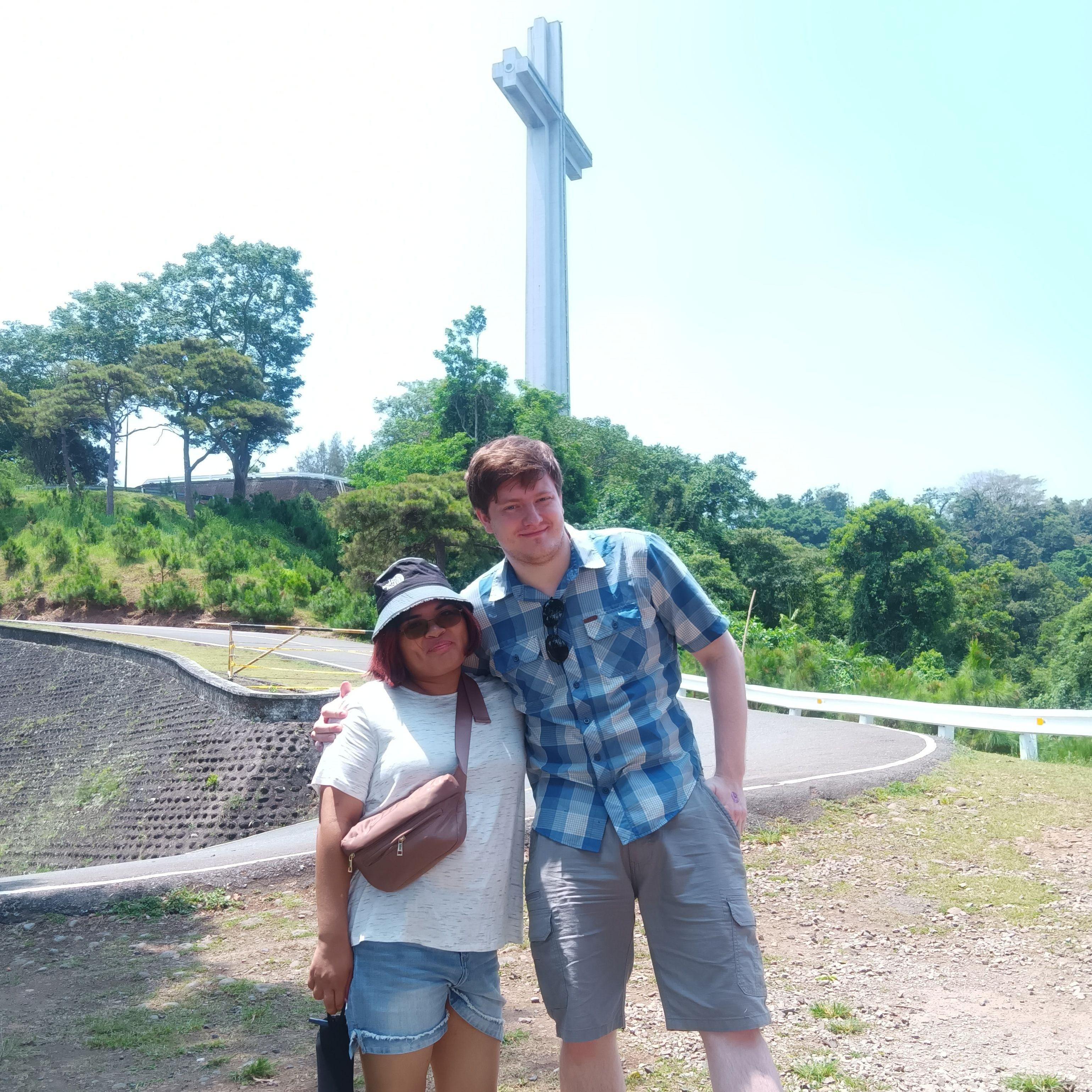 Visiting the Philippines at a big cross.