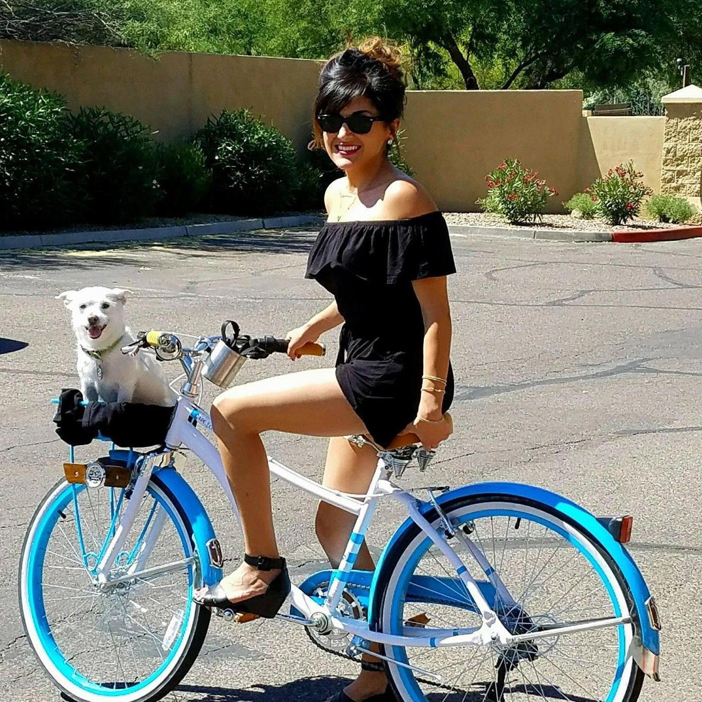On the weekends, we always like to cruise around on our bikes. Jess crashes a lot. We need to add training wheels. On the flip-side, she looks great!

In the basket is Jack, Jessica's lil' monster.