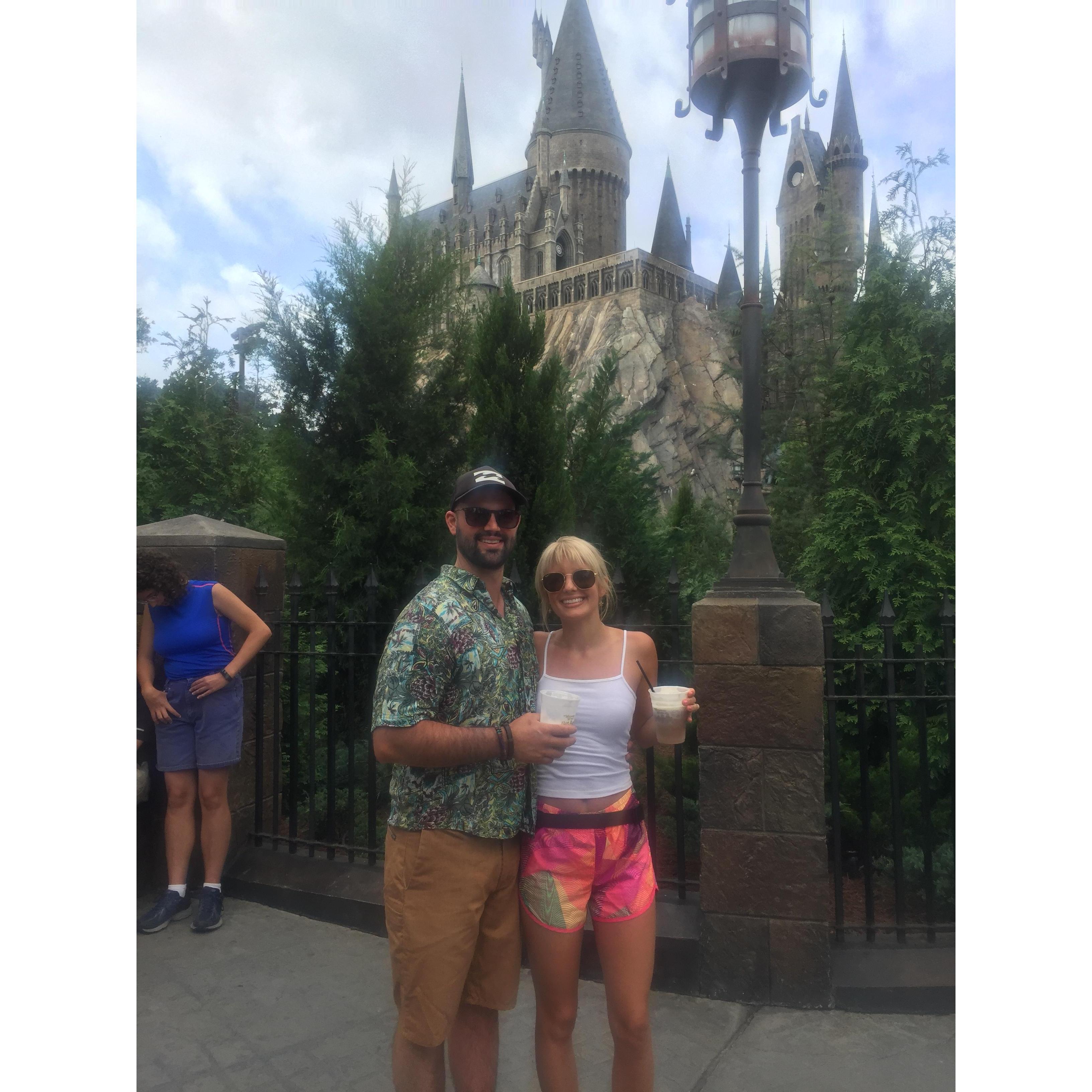 We rode almost every single roller coaster at Universal Studios! We're holding butter beer in front of Harry Potter World in May, 2019.