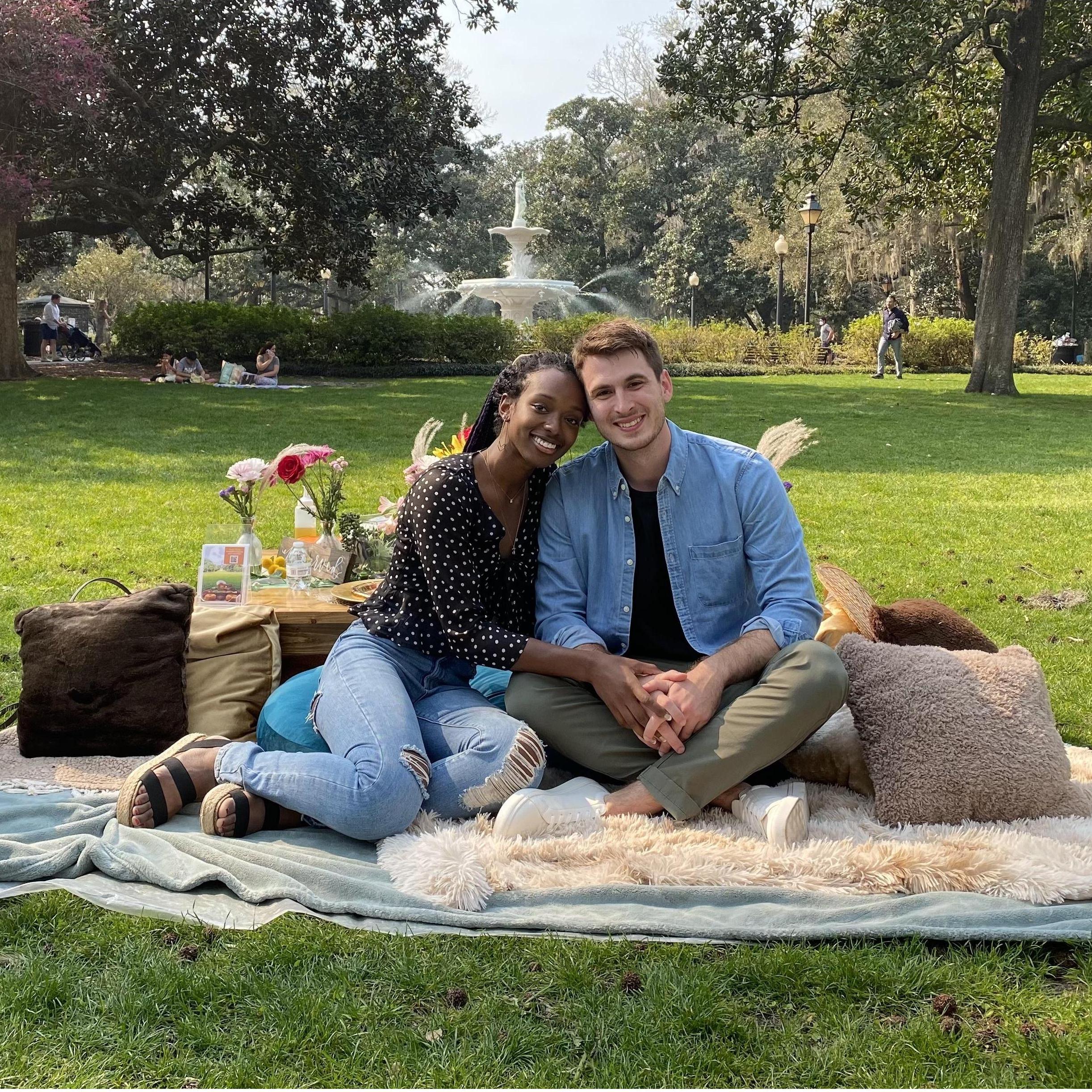 Enjoying a lovely picnic in front of the fountain in Forsythe Park where Cameron would propose just moments later. Savannah, GA, March of 2021.