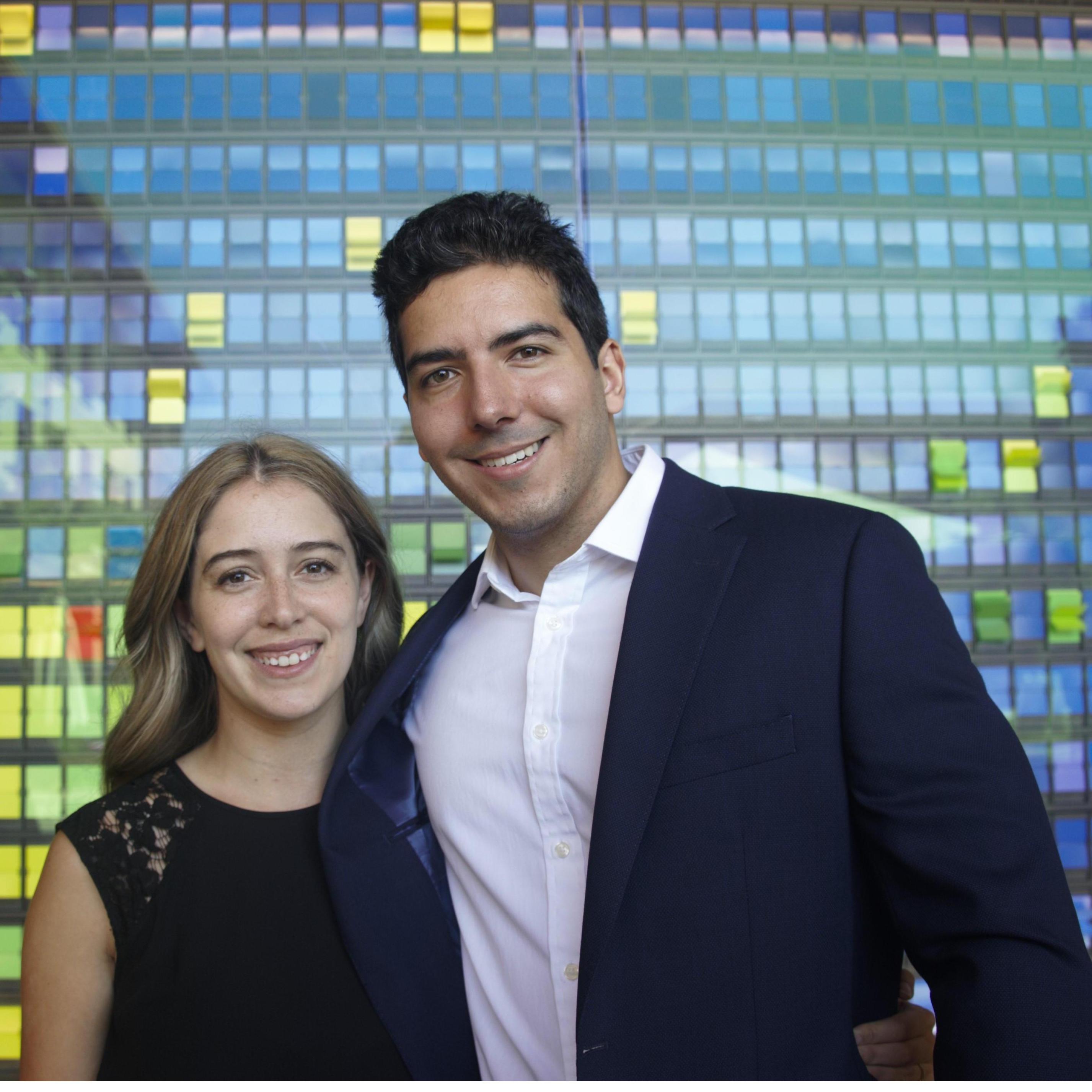 In front of the "Wall of Change" at Stanford Graduate School of Business