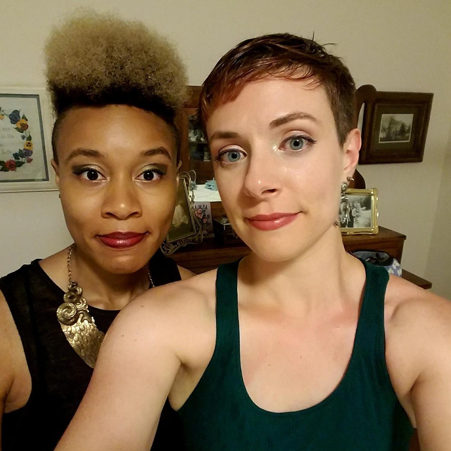 Maid of Honor and the Bride, post rain storm, faces still in place.