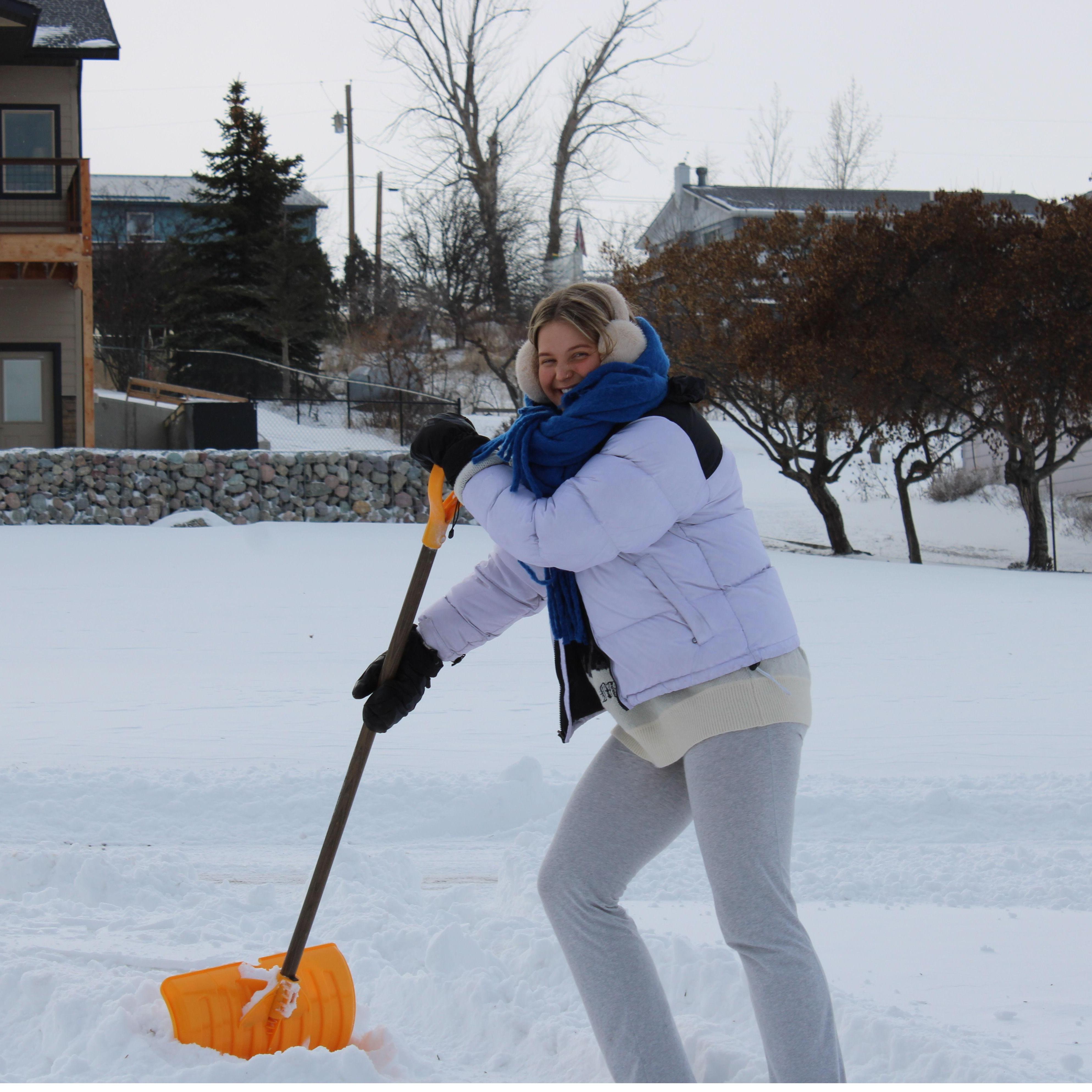 Tess's first time shoveling the driveway.