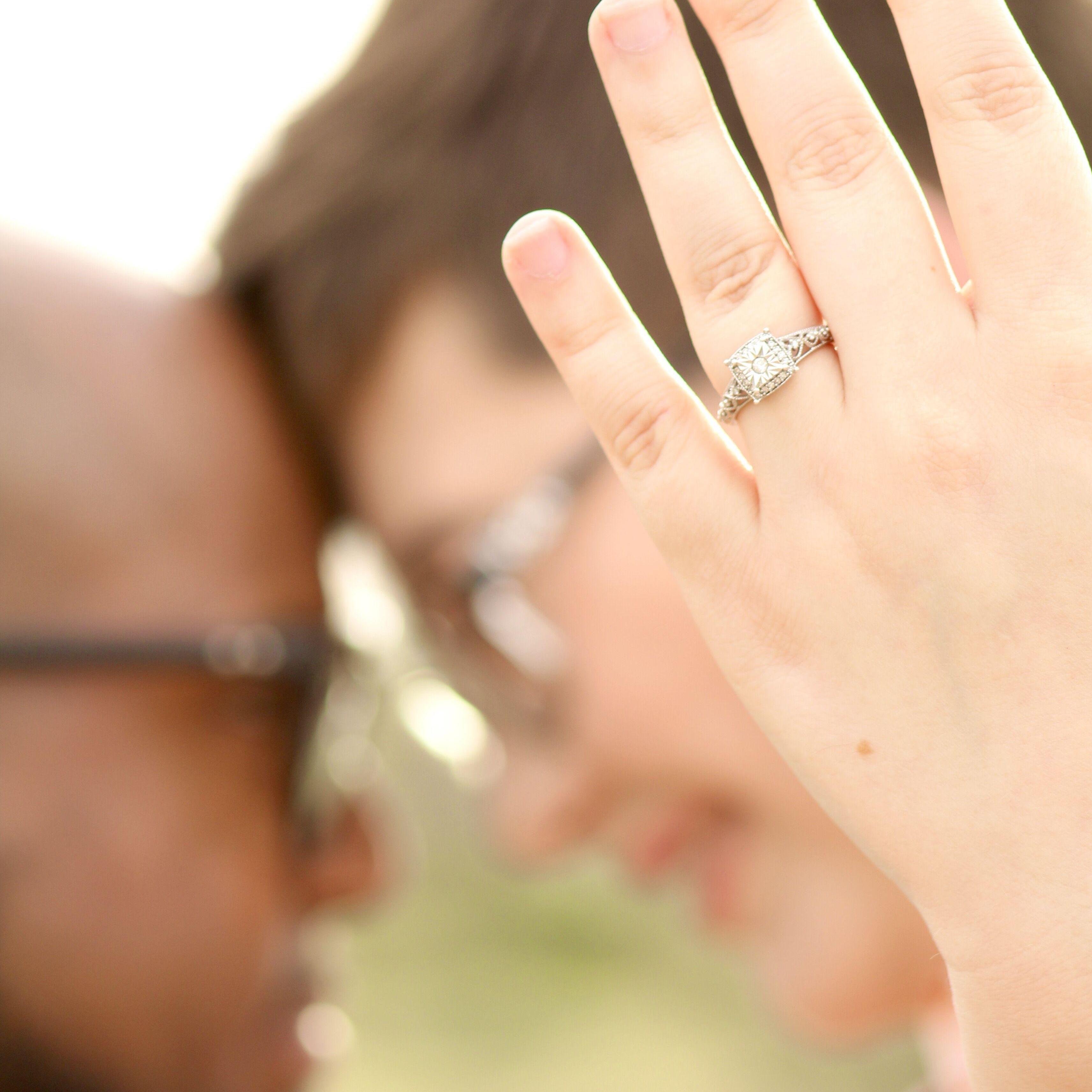 Beautiful shot of the engagement ring. I'm currently giggling in the back as Daron is smiling and trying not to crack.