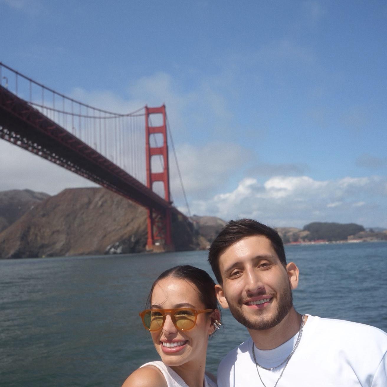 Just two loversss underneath the Golden Gate bridge