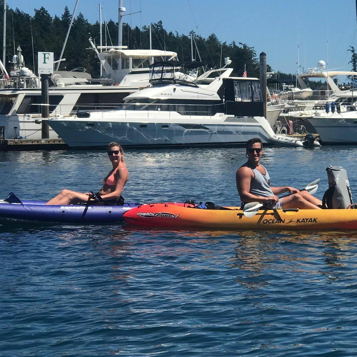 Kayaking around Roche Harbor, probably with San Juan Seltzers between our water shoes.