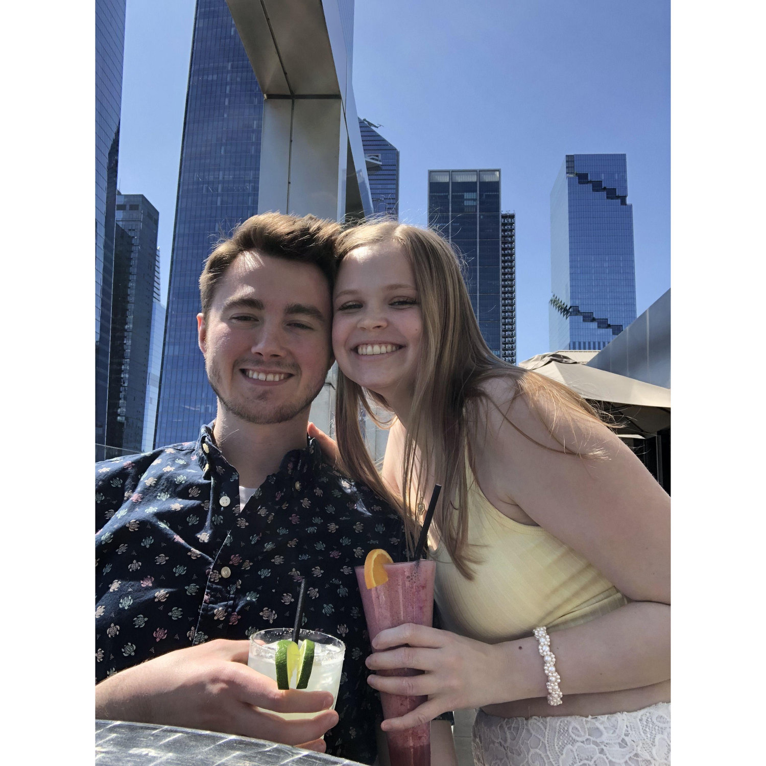 Margaux and Austin on a rooftop patio in the summer.