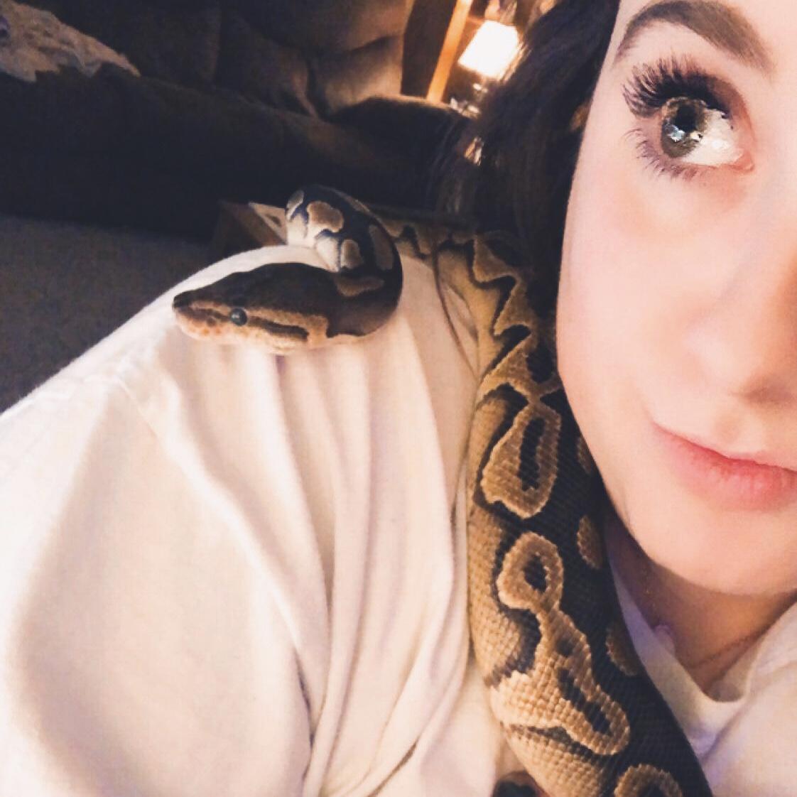 Kelly and one of their ball pythons, Pretzel!