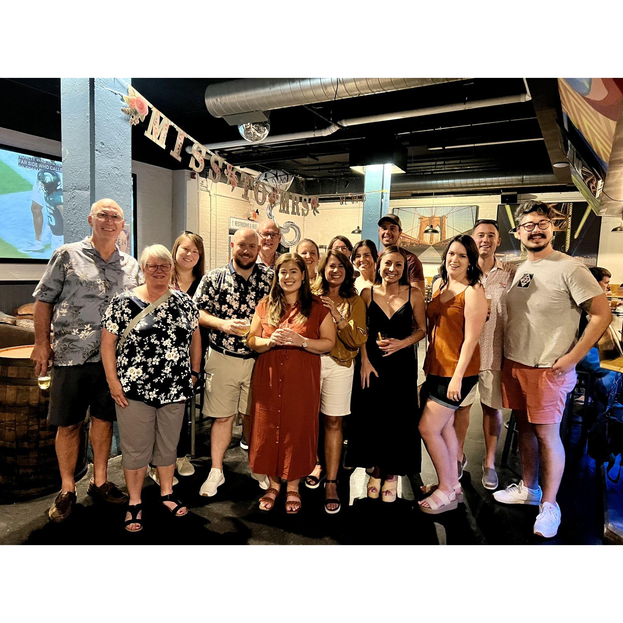 After Sam said "Yes," Charlie arranged for family and friends to celebrate at Mile Wide Brewing!