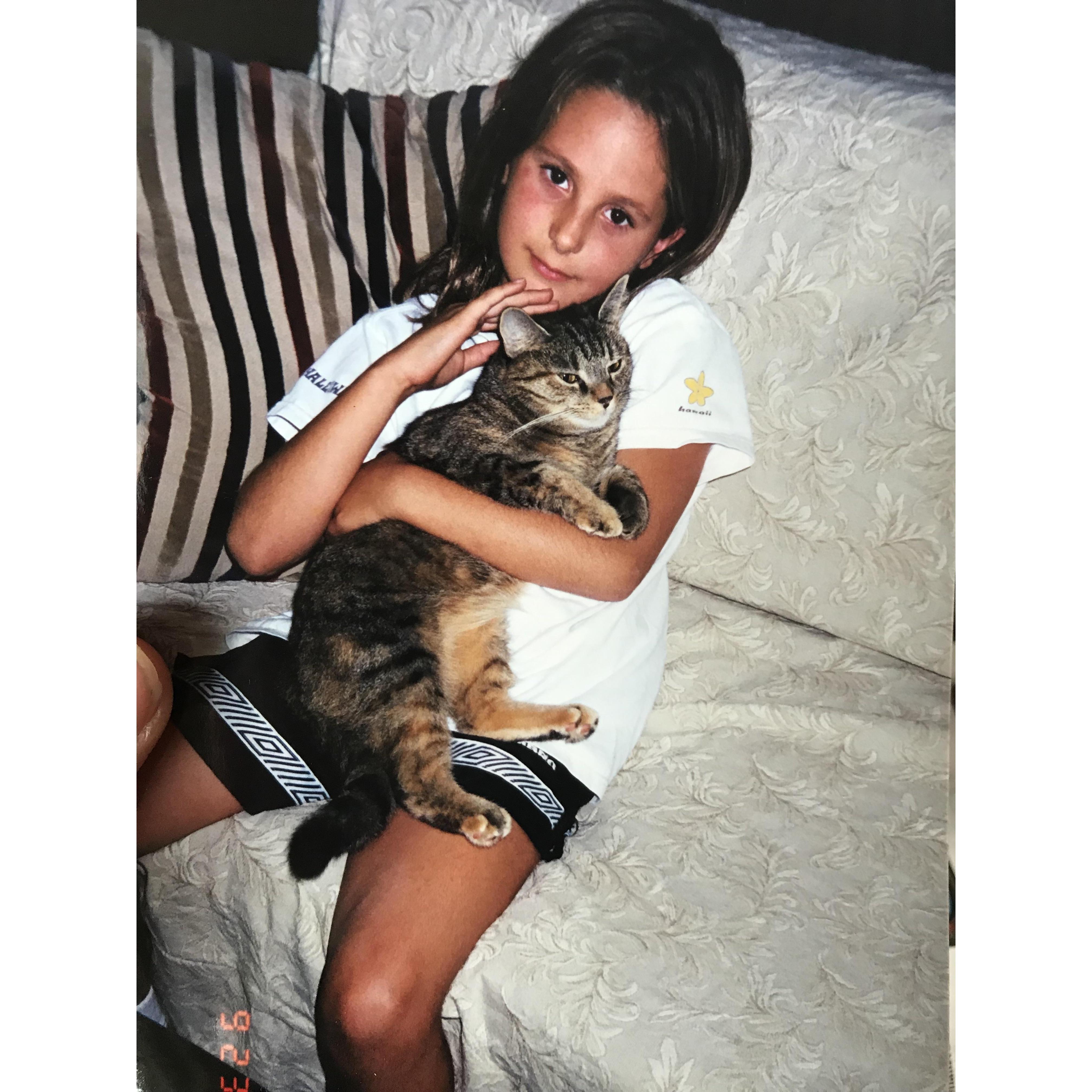 Caroline holding her first cat Jasmin.