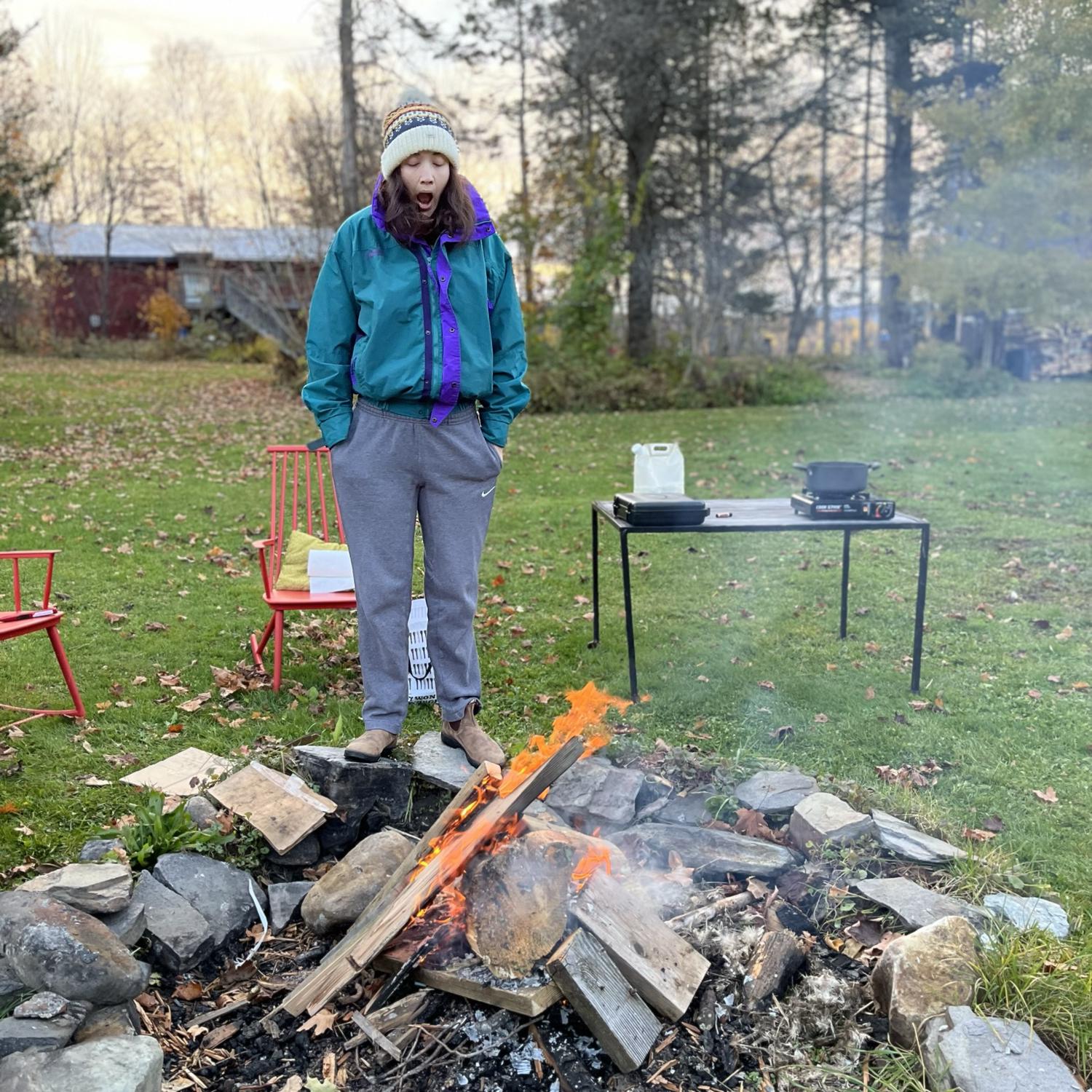 Chilly yawns around a morning fire