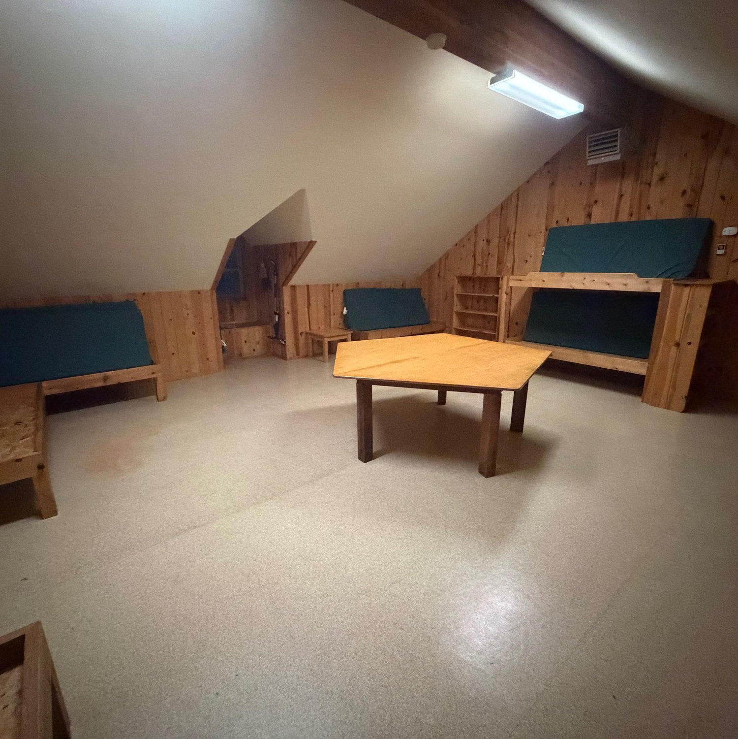 Indoor Unit - "Boathouse" This unit is one giant open room. It has several beds but no bathroom or kitchen inside. A full bath is nearby