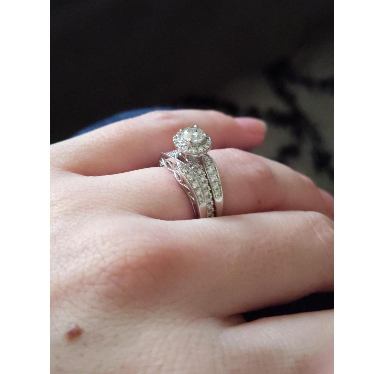 Zak surprised Kayla with a trail of flower petals leading from the front door to the kitchen... where he was waiting on one knee with this beautiful ring and their little boy, Ronin