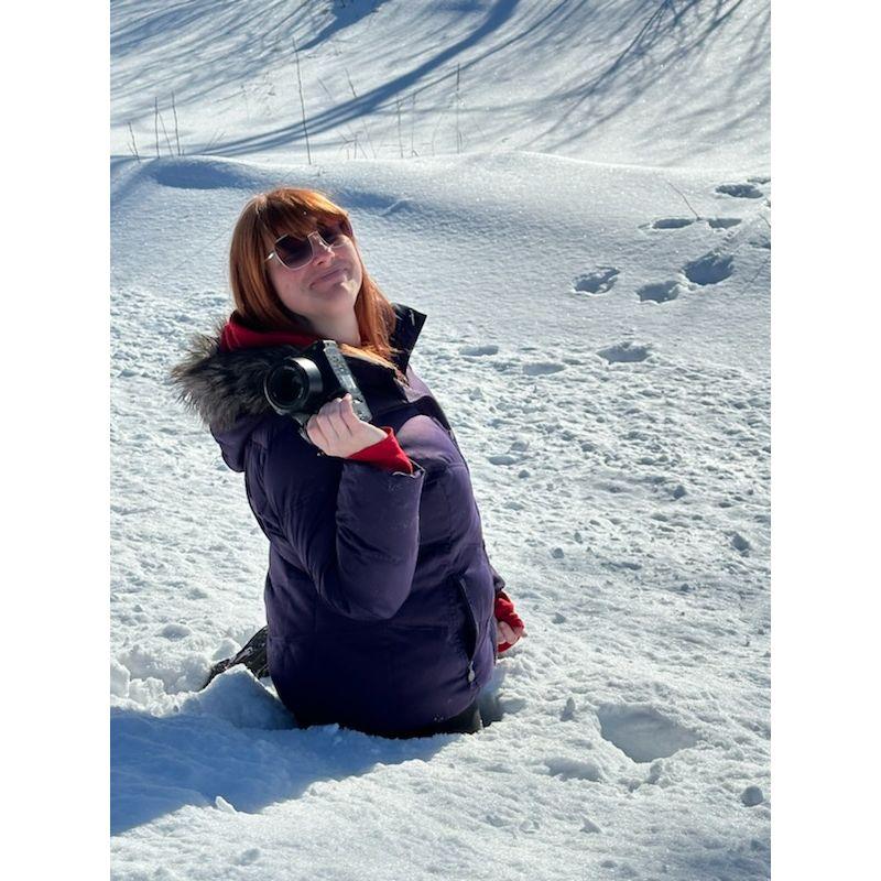Abby didn't realize snow drifts in Alaska were no joke. Also, those are bear paw prints behind her!!