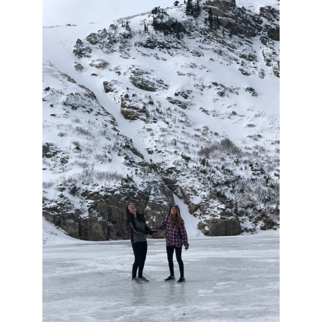 Standing on the frozen lake at St. Mary's Glacier in Colorado