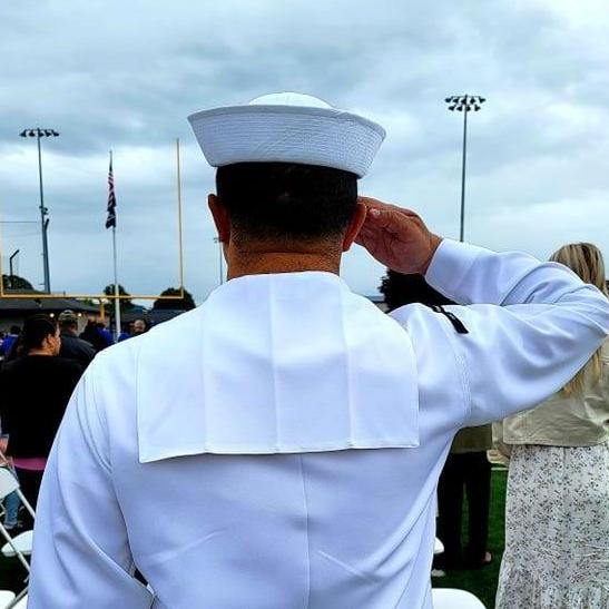 Michael saluting at Malia's graduation. Love this photo :). -Rachael