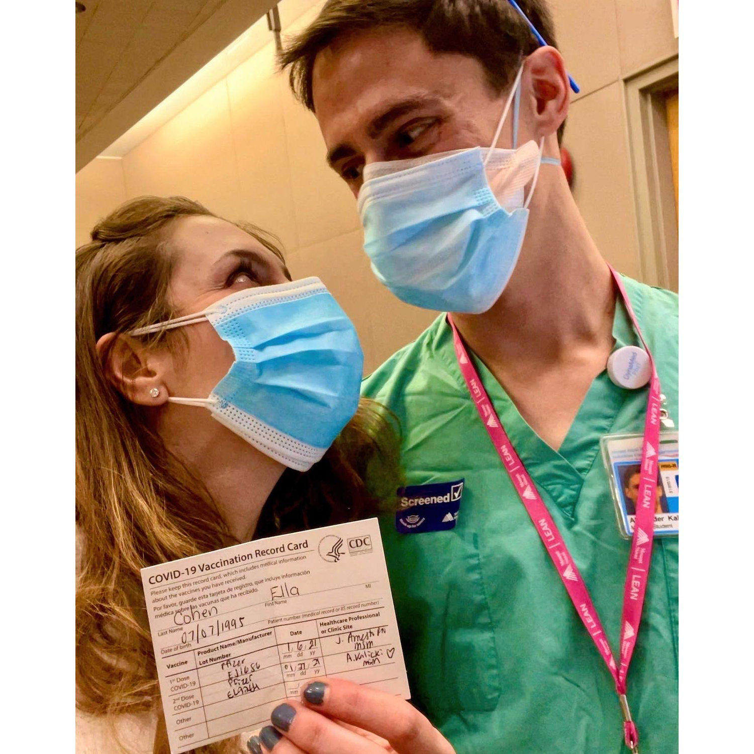 A photo from 1/2021 after Alex gave Ella her COVID vaccine! She was lucky to be able to get the vaccine at this point, and even luckier to have such a cute vaccinator!