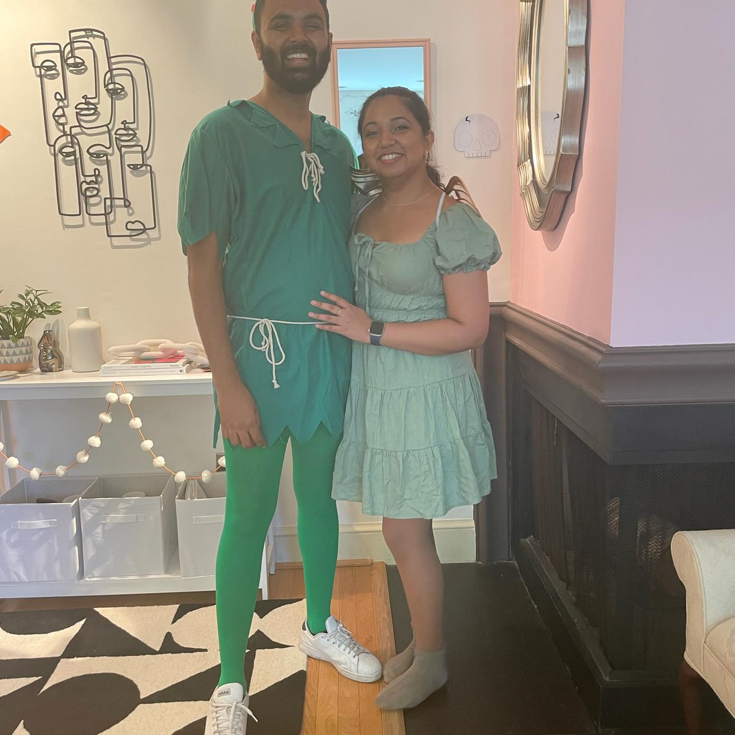 Peter Pan and Tinker Bell. Mihir is wearing tights.