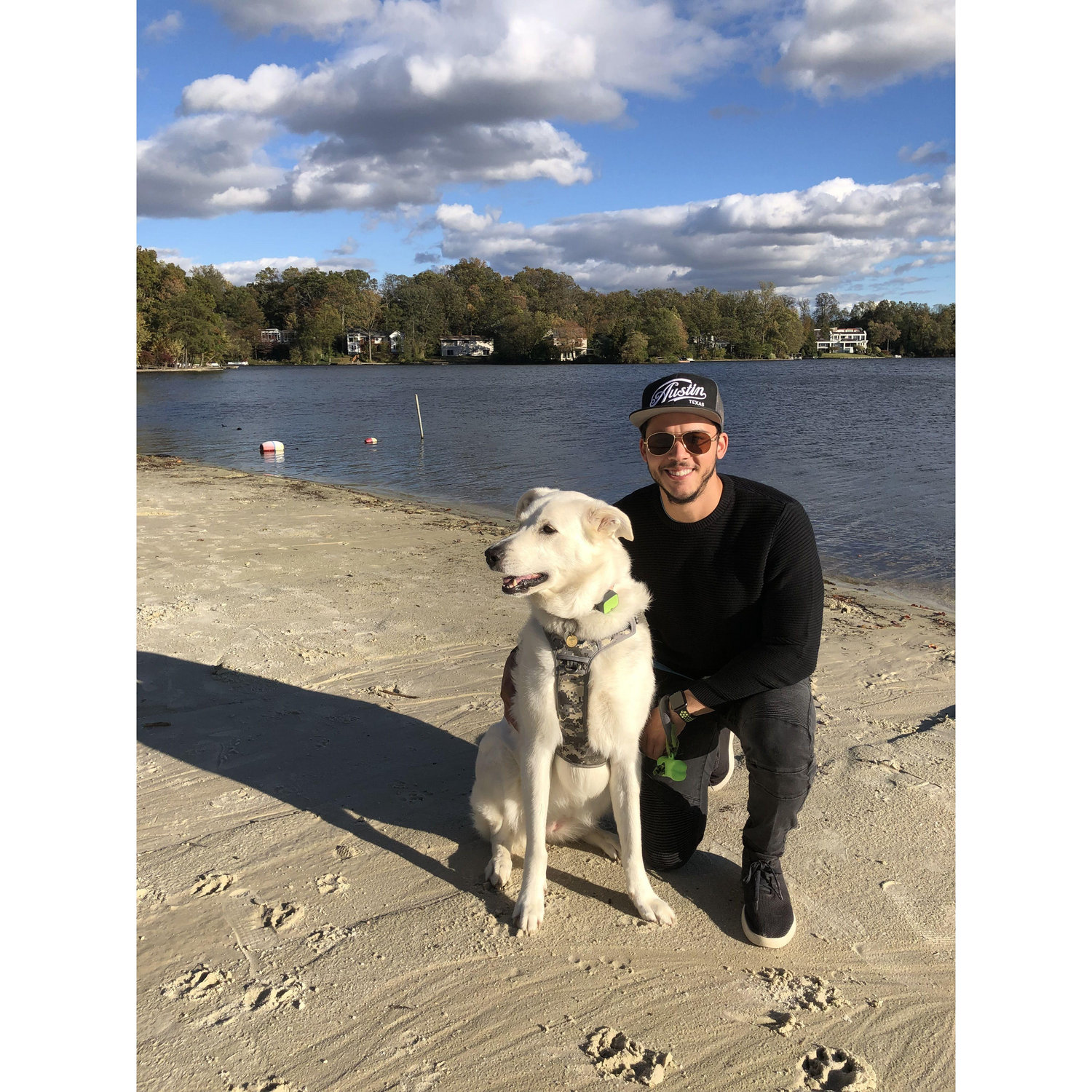 Trying to keep Sophie from barking during a photo on the beach at Lake Barcroft.