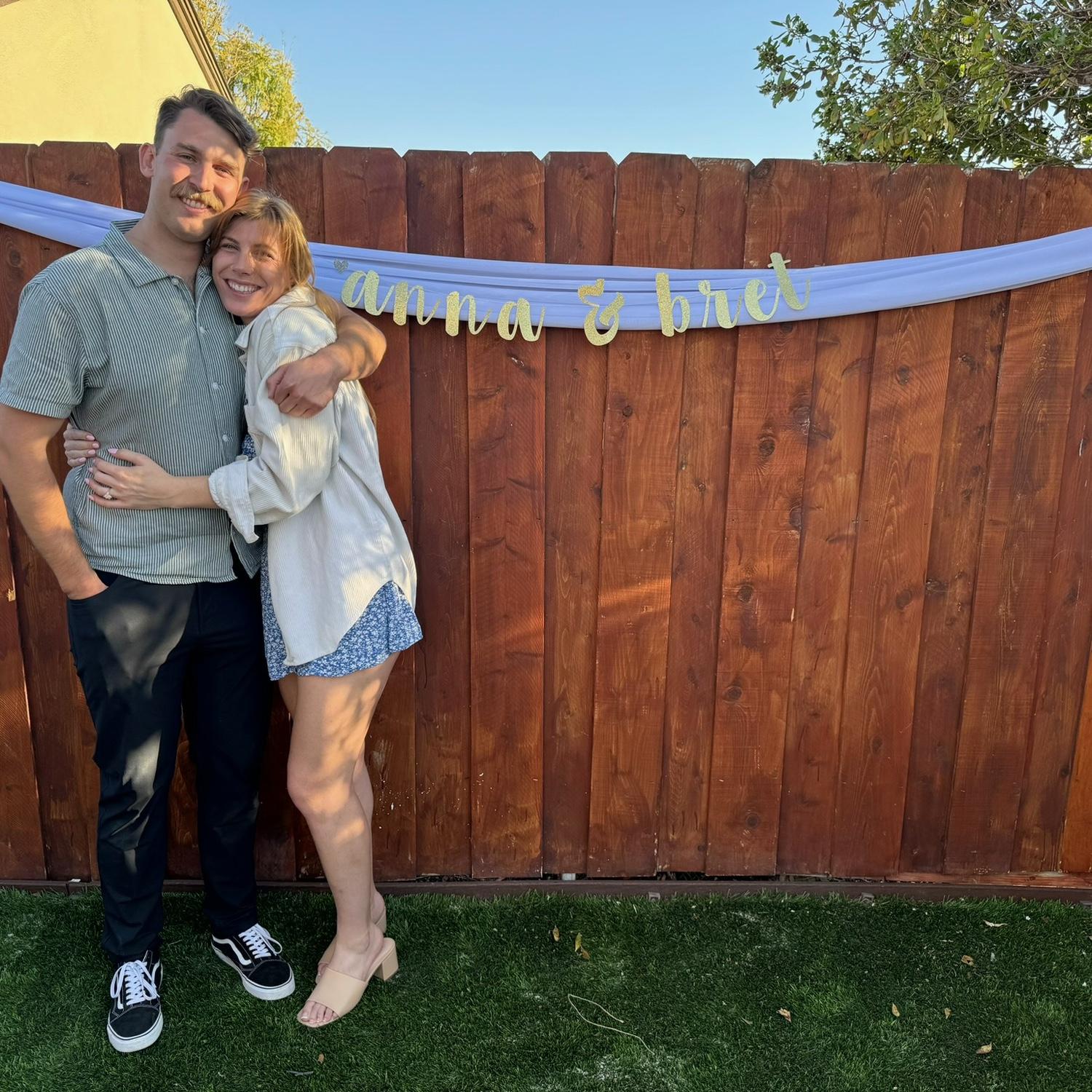 Us at our surprise proposal party in 2024