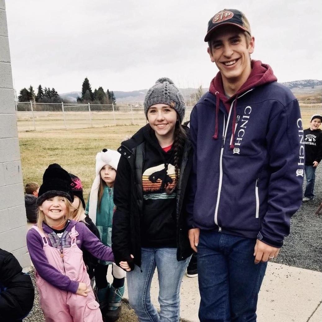 Isaiah, Faith, and Piper at the school's Turkey Trot in their senior year