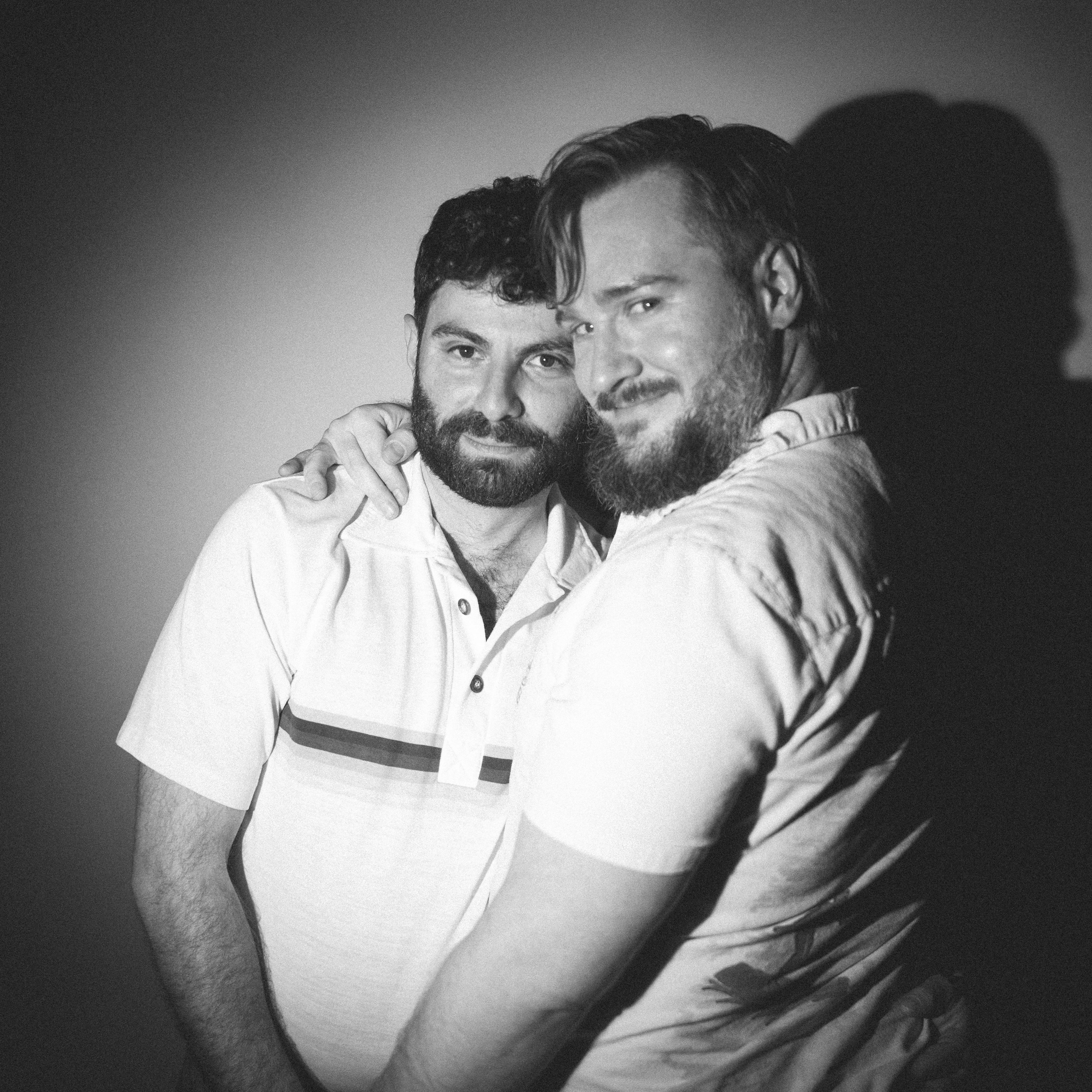 We threw our own engagement party, the guests didn't know the purpose. We hired our engagement photographer friend Eric to document the night, and set up a photo booth downstairs. Wigs galore!
