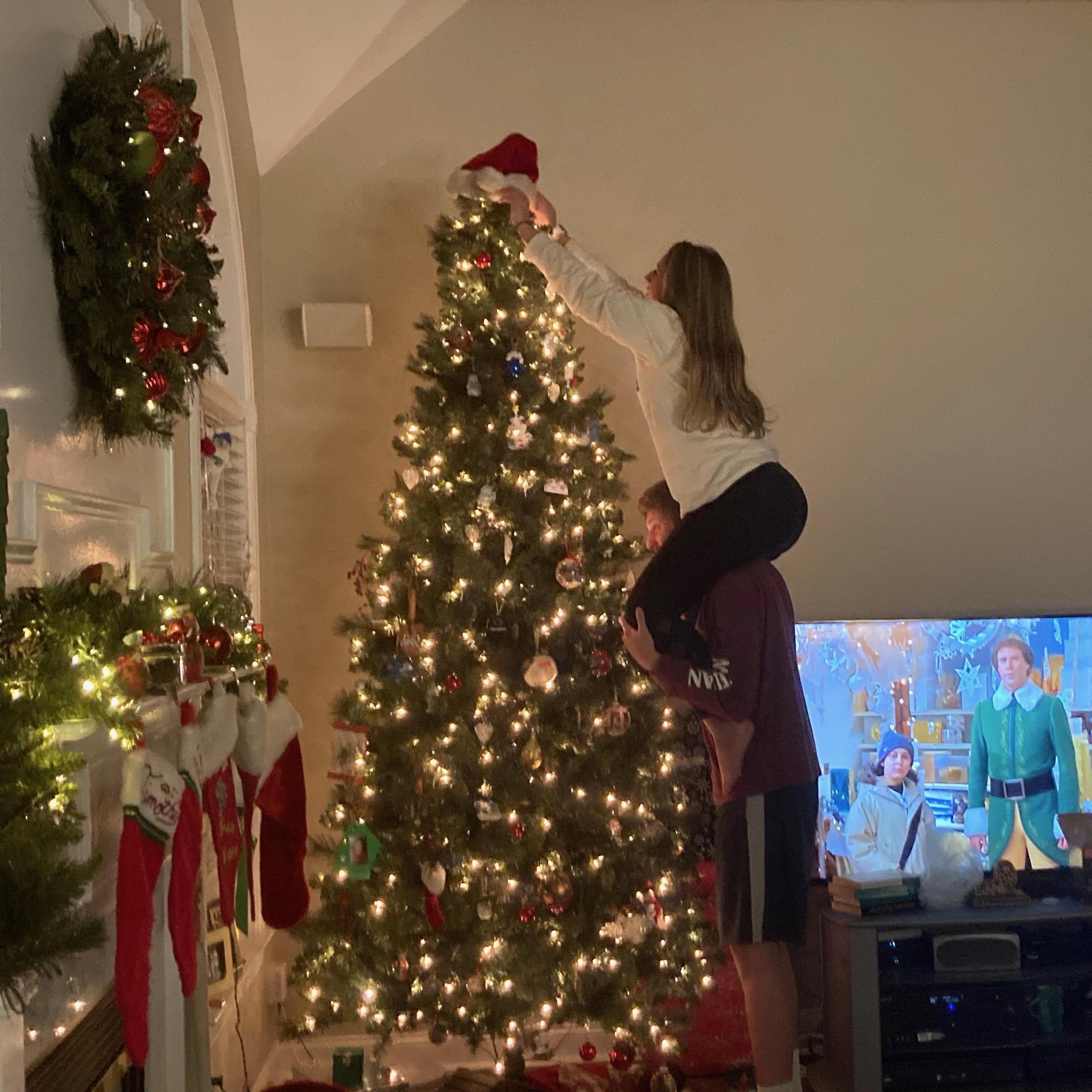 Christmas 2020 - Putting the hat on the top of the tree