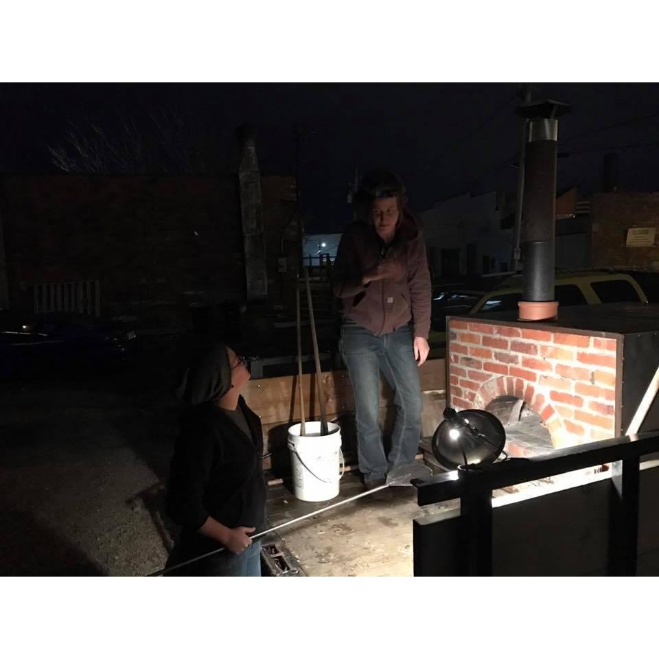 Slinging some wood fired pizzas!