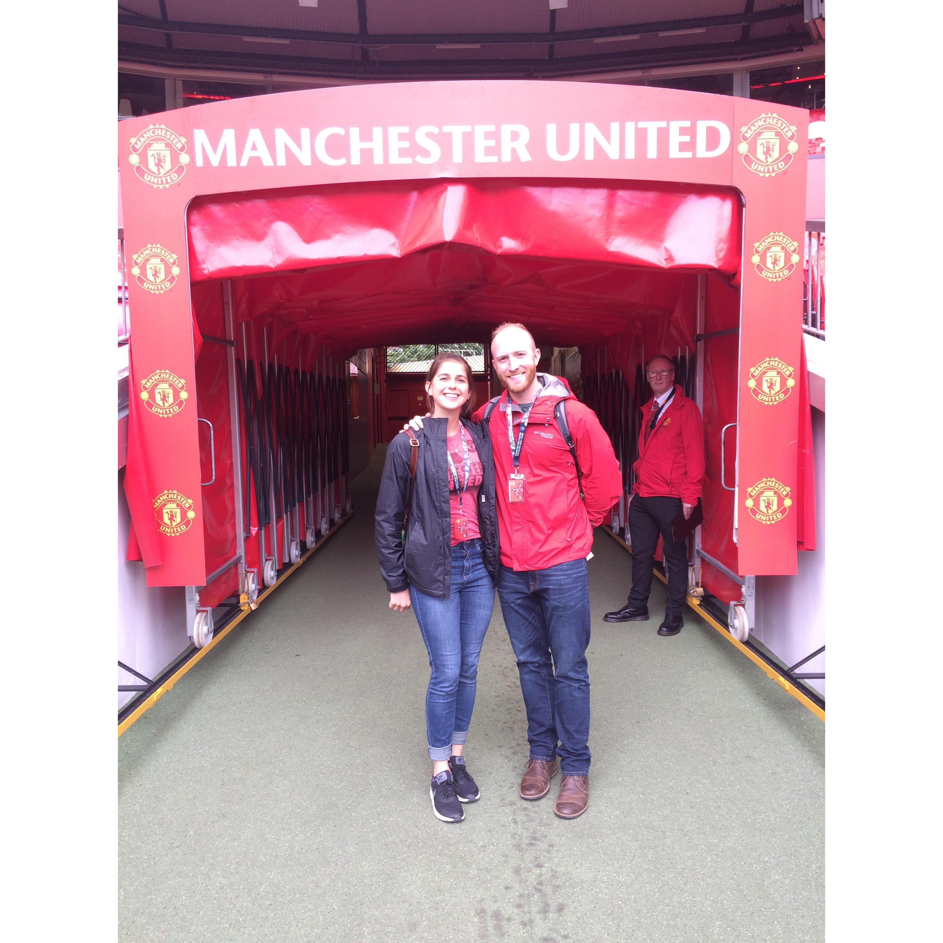 Jared and Caitlin at Manchester United during a work trip in August 2017.