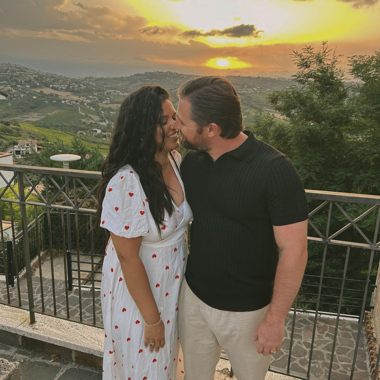 The bride & groom checking their breath in Italy on the terrace enjoying being newly engaged! Photographer: Flick