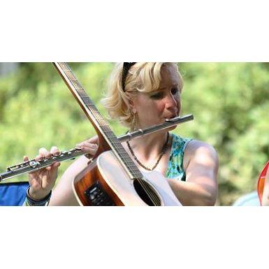 Jennifer playing flute at CERT picnic August, 2013.
