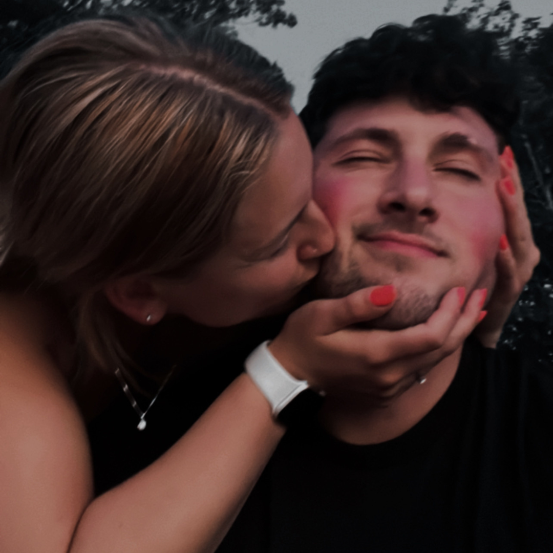 Grabbing my face so hard.