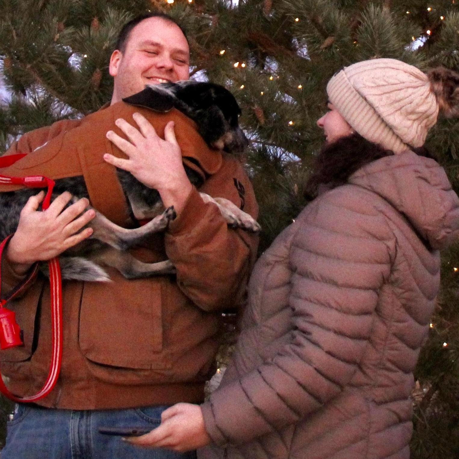 Christmas photos don't go as planned when the pup wants attention