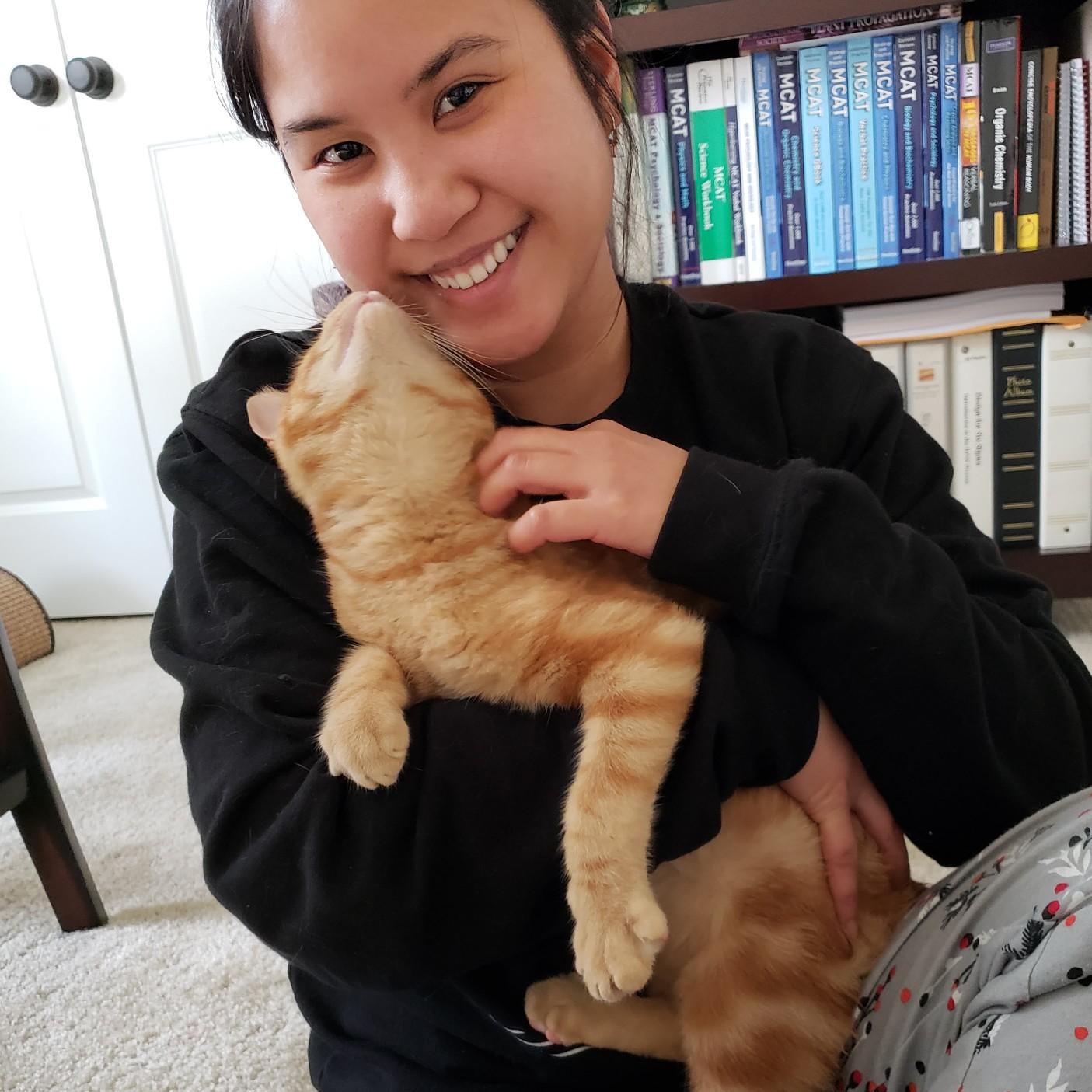 Lorena holding Cheddar, which almost never happens! Cheddar is very shy!