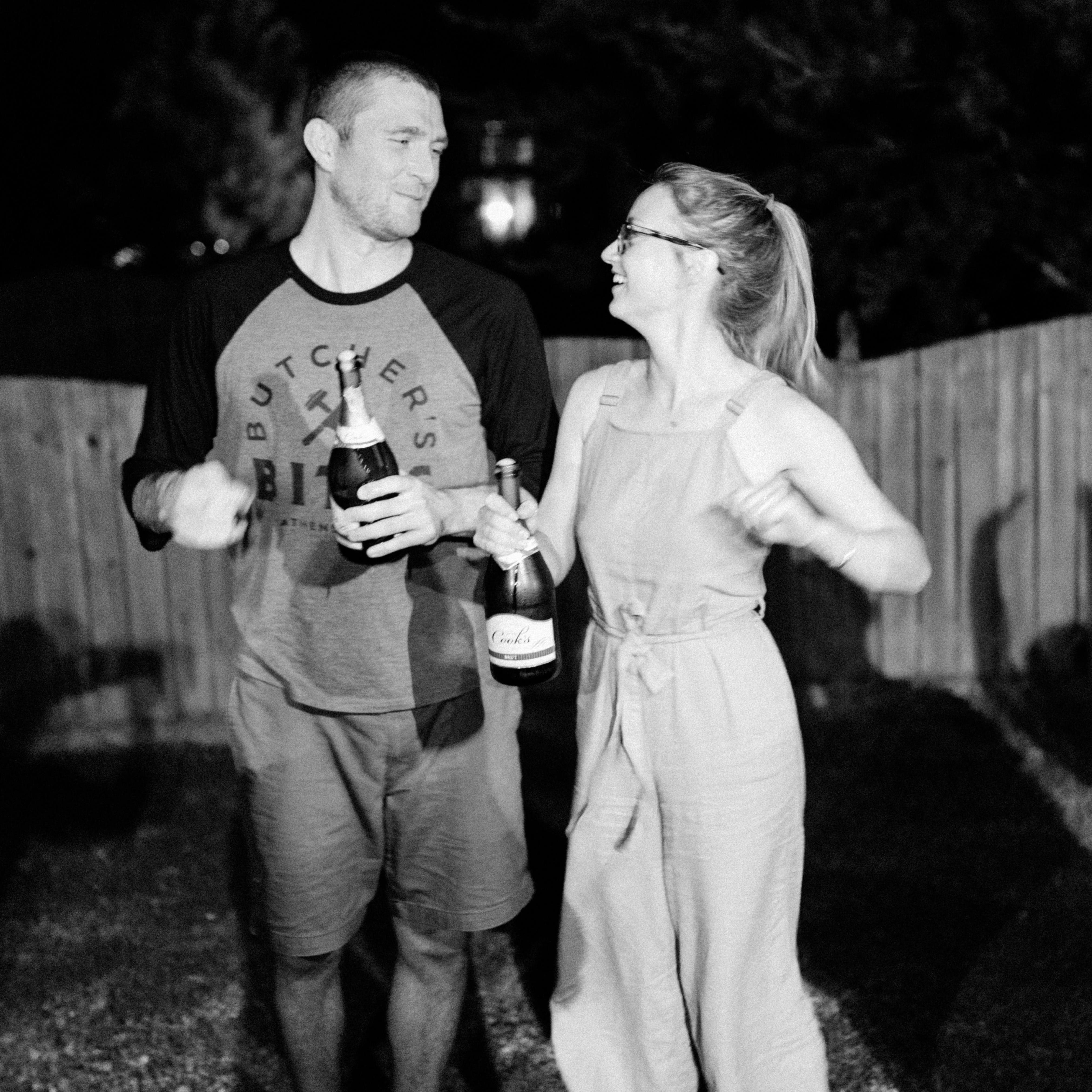 The night we got engaged, our friends were ready to take our photos and drink champagne!